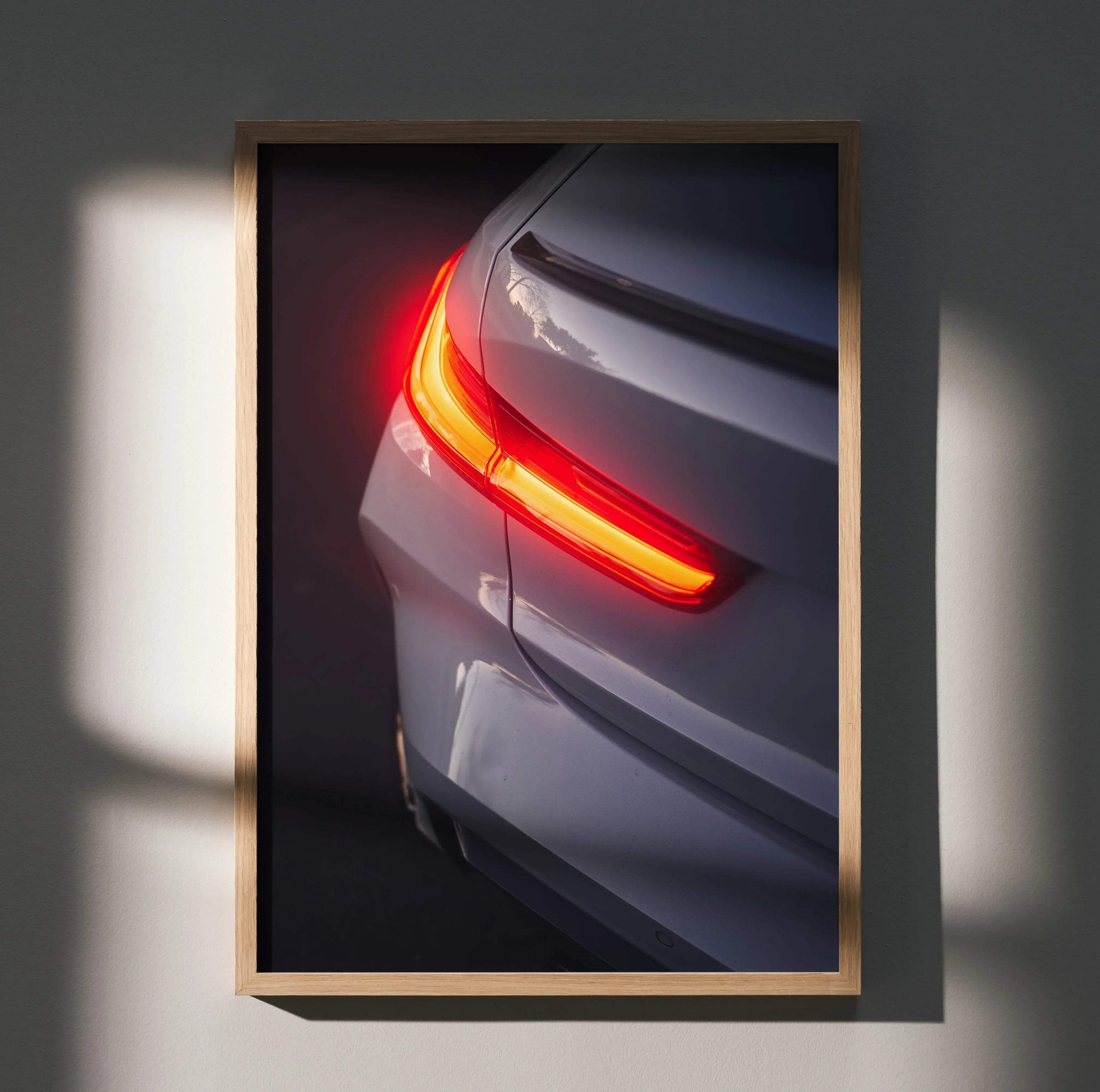 BMW G80 M3 rear close-up poster showcasing illuminated taillight in sleek gray, wall art with high contrast lighting.
