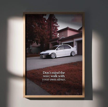 Motivational poster wall art featuring a white Mitsubishi Evo 8 parked on a suburban street with inspiring text in muted.