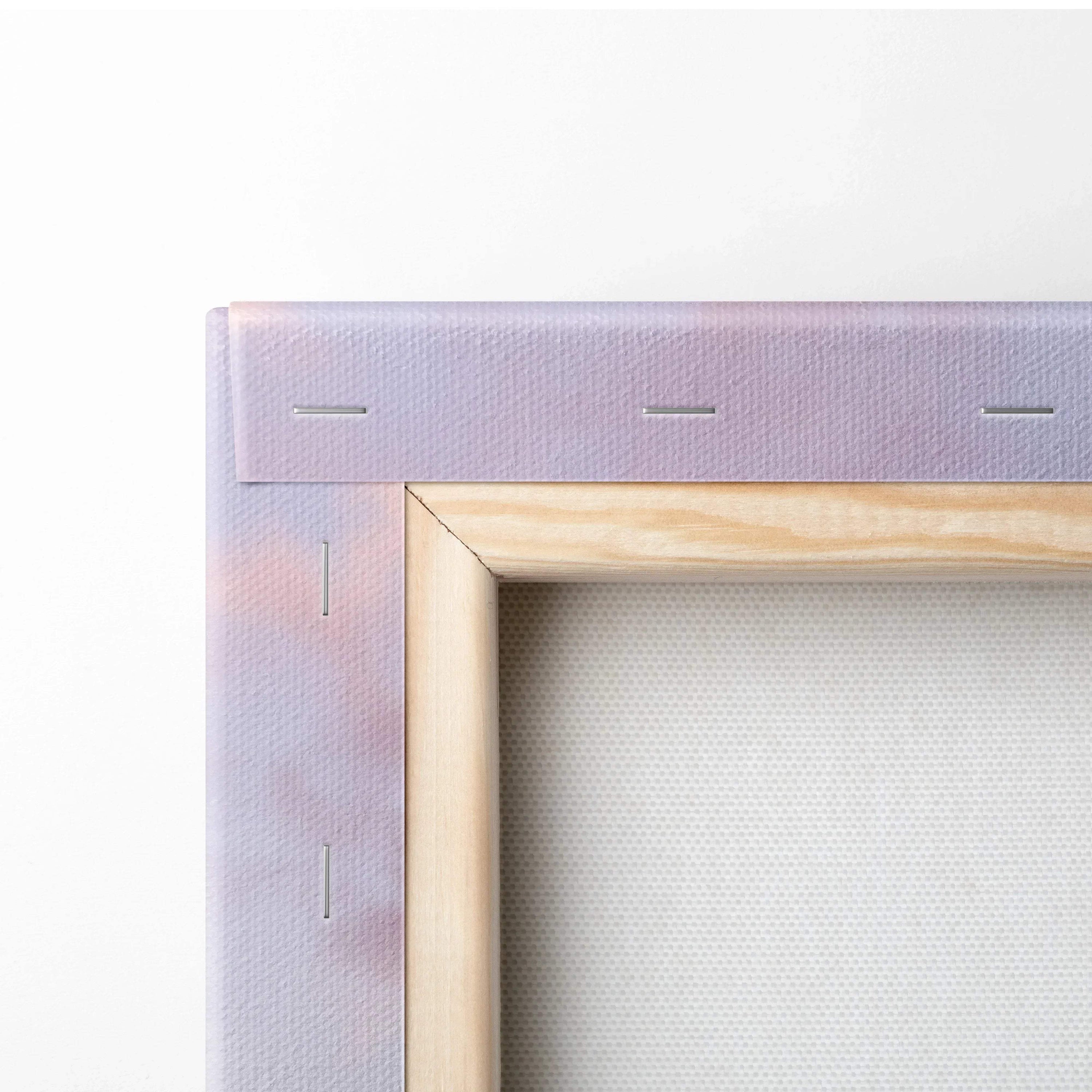 Close-up of natural wood frame and stapled white canvas for vertical wall art canvas print.