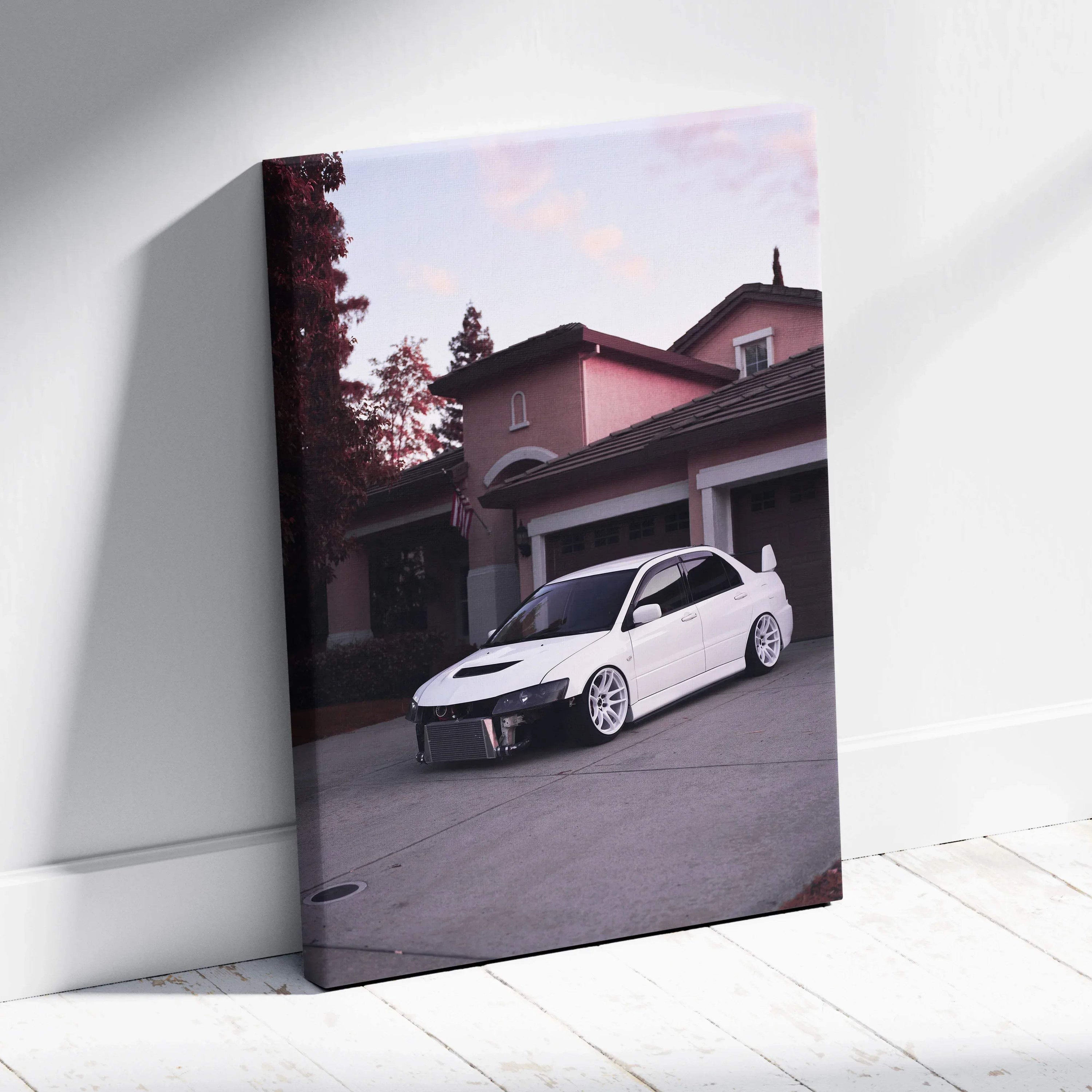 White Mitsubishi Evo 8 car on driveway automotive canvas wall art with soft sunset sky.