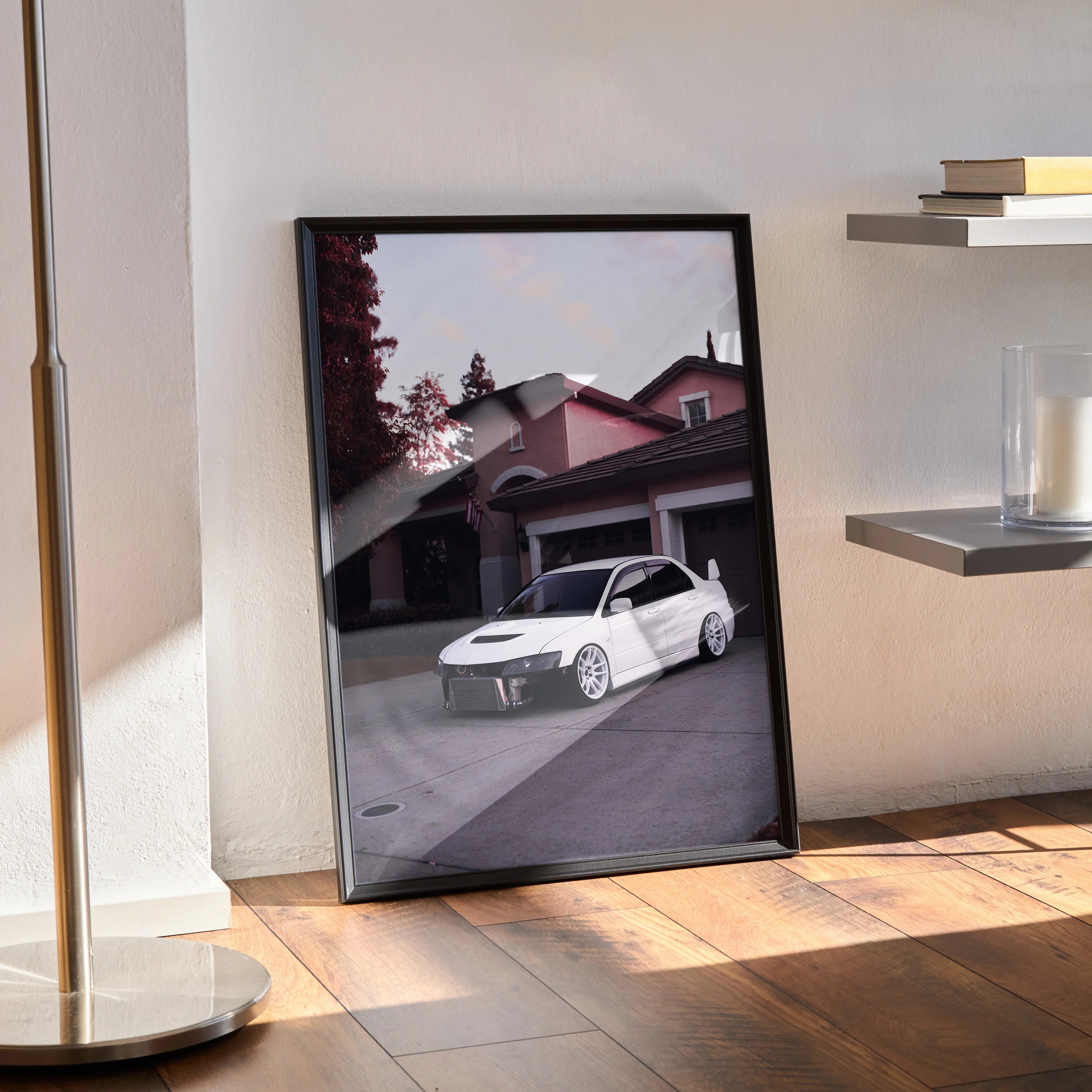 Mitsubishi Evo 8 poster wall art featuring white car parked in front of house with trees in background.