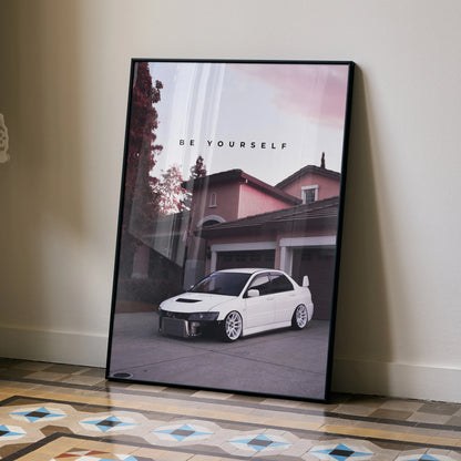 Motivational poster wall art featuring white Mitsubishi Evo 8 parked in front of a residential garage with "BE YOURSELF" text.