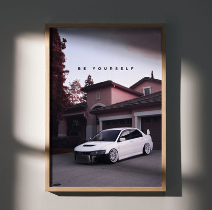 Motivational poster wall art featuring a white Mitsubishi Evo 8 parked in front of a house at dusk with "Be Yourself" text.