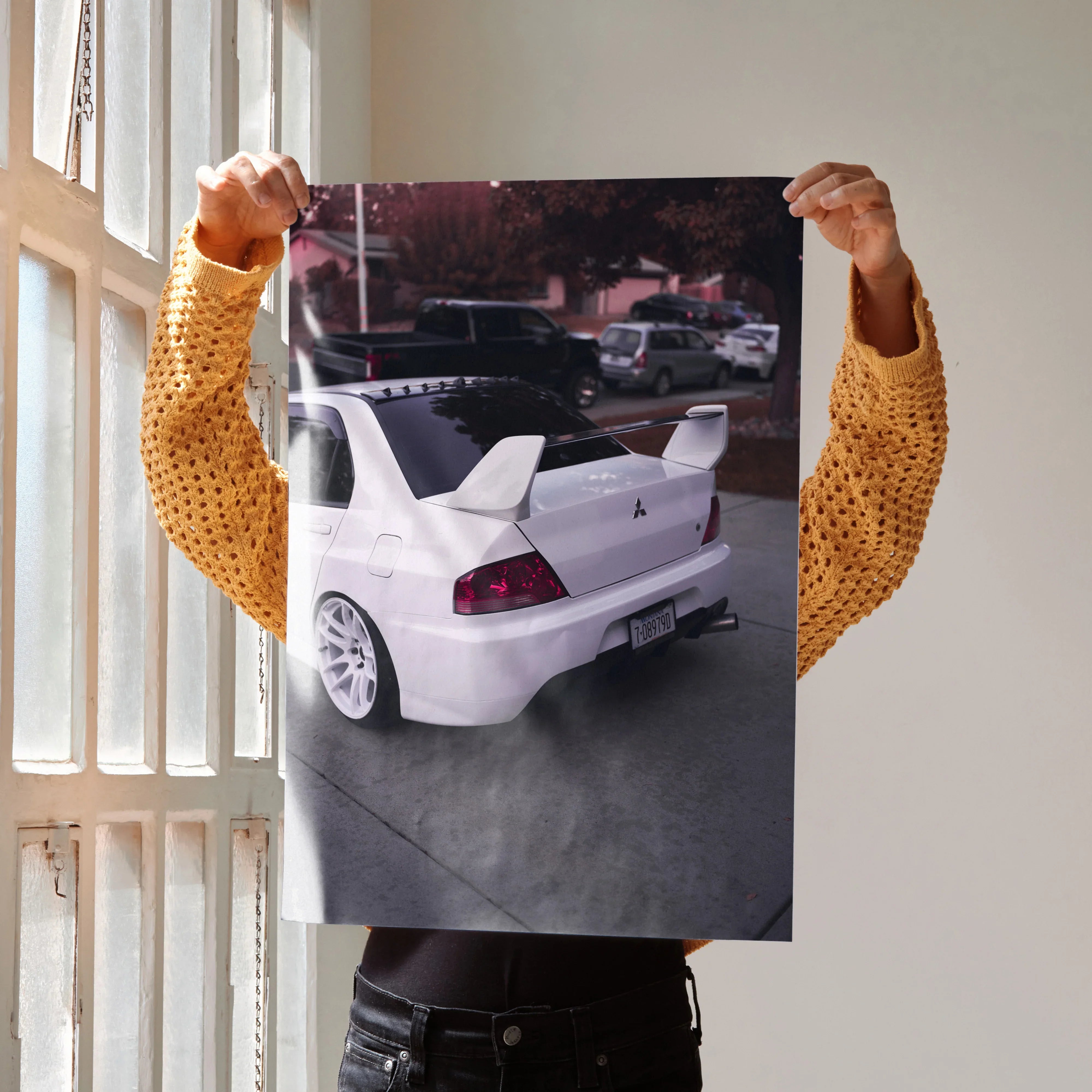 Mitsubishi Evo 8 rear view poster wall art showcasing white sports car with spoiler and street background.