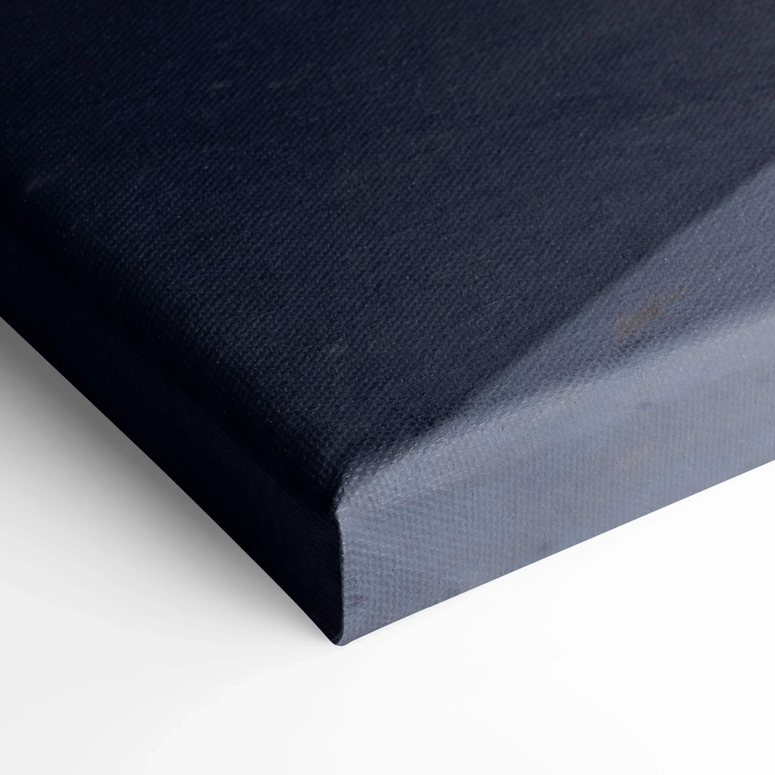 Close-up of stretched canvas corner in dark blue for wall art print with museum-quality texture.