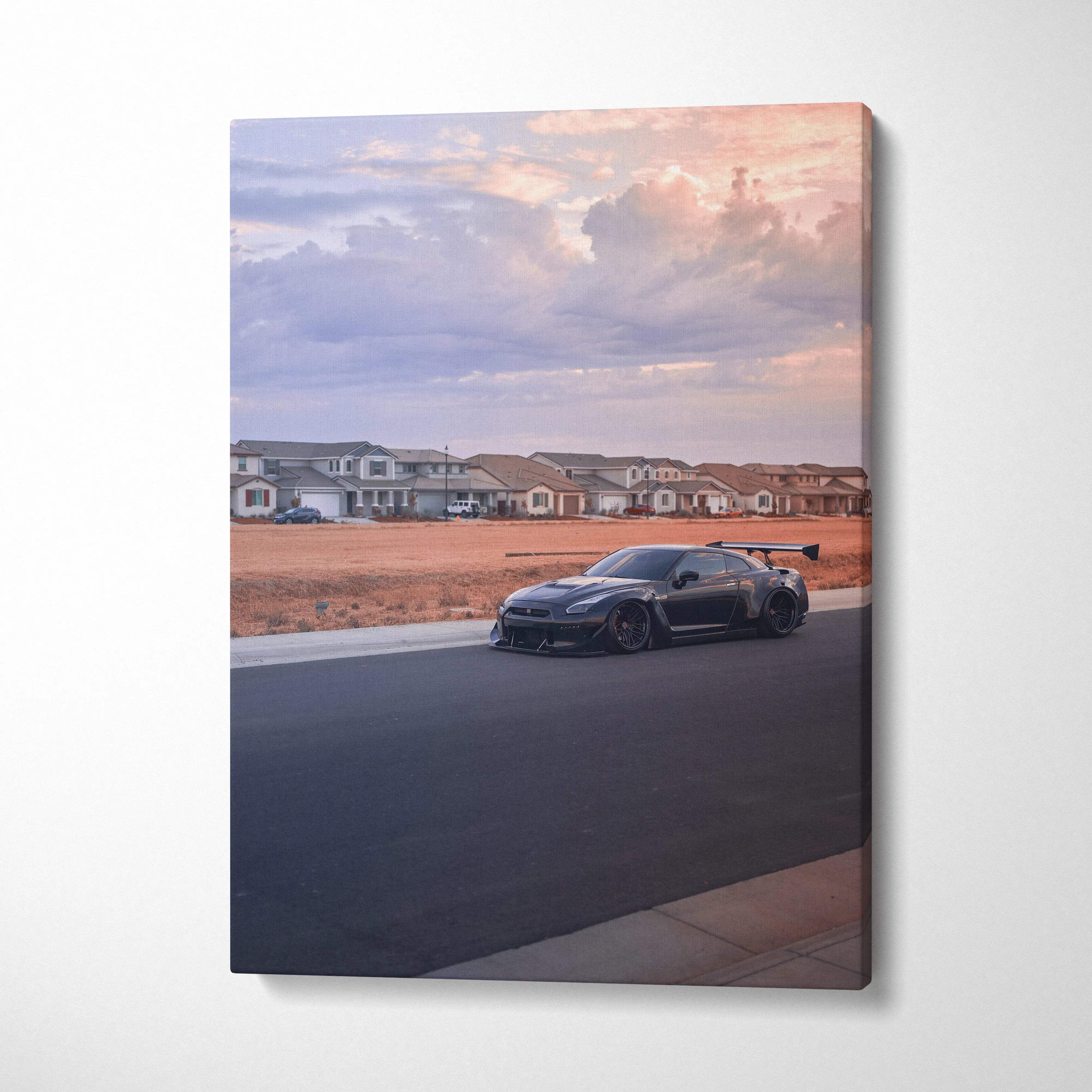 Nissan R35 GTR parked on quiet street at sunset with soft sky on vertical canvas wall art.