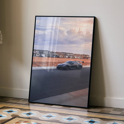 Nissan R35 GTR widebody sunset poster wall art with sleek black car on track.