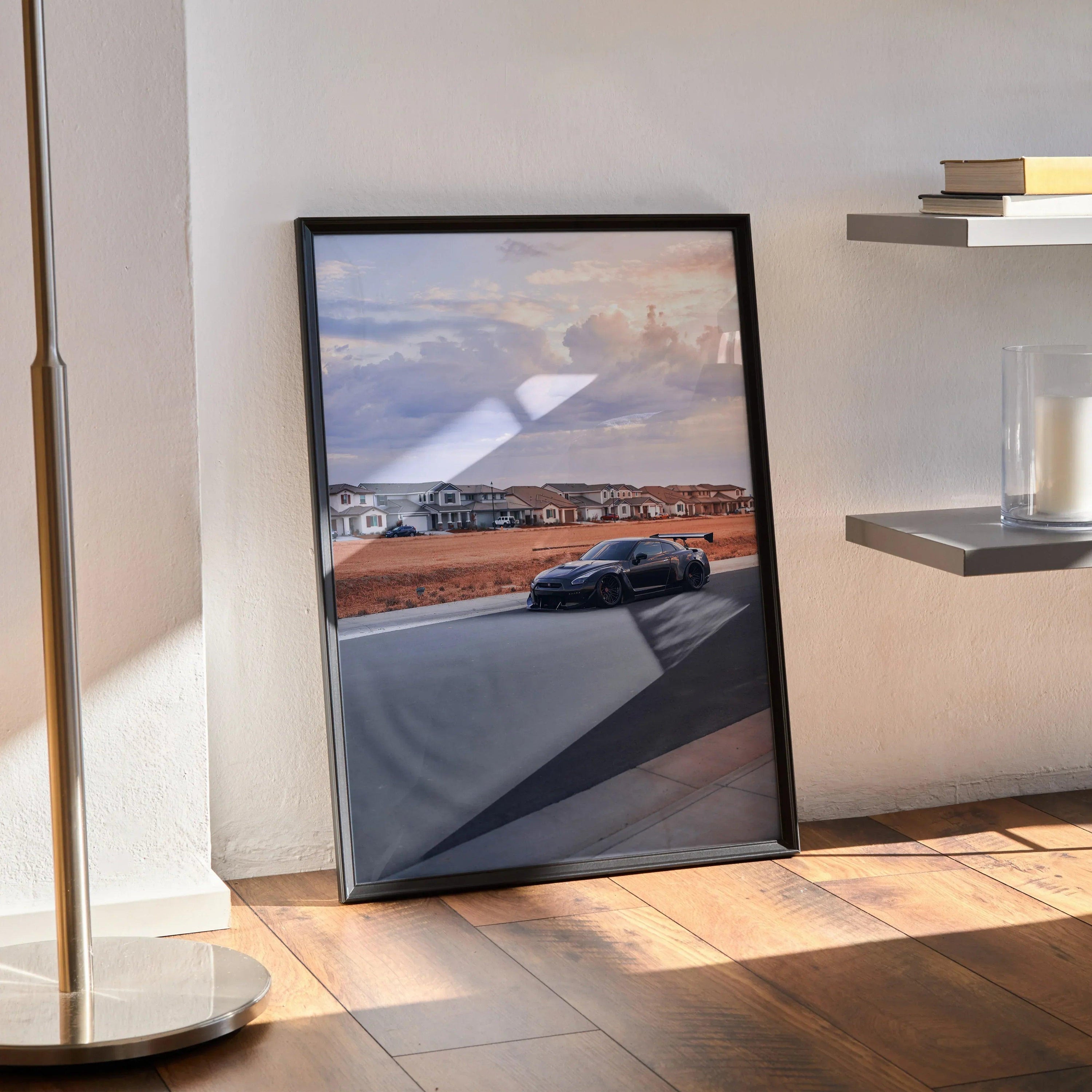 Nissan R35 GTR widebody poster with sunset background, sleek car on road, wall art print in black frame.