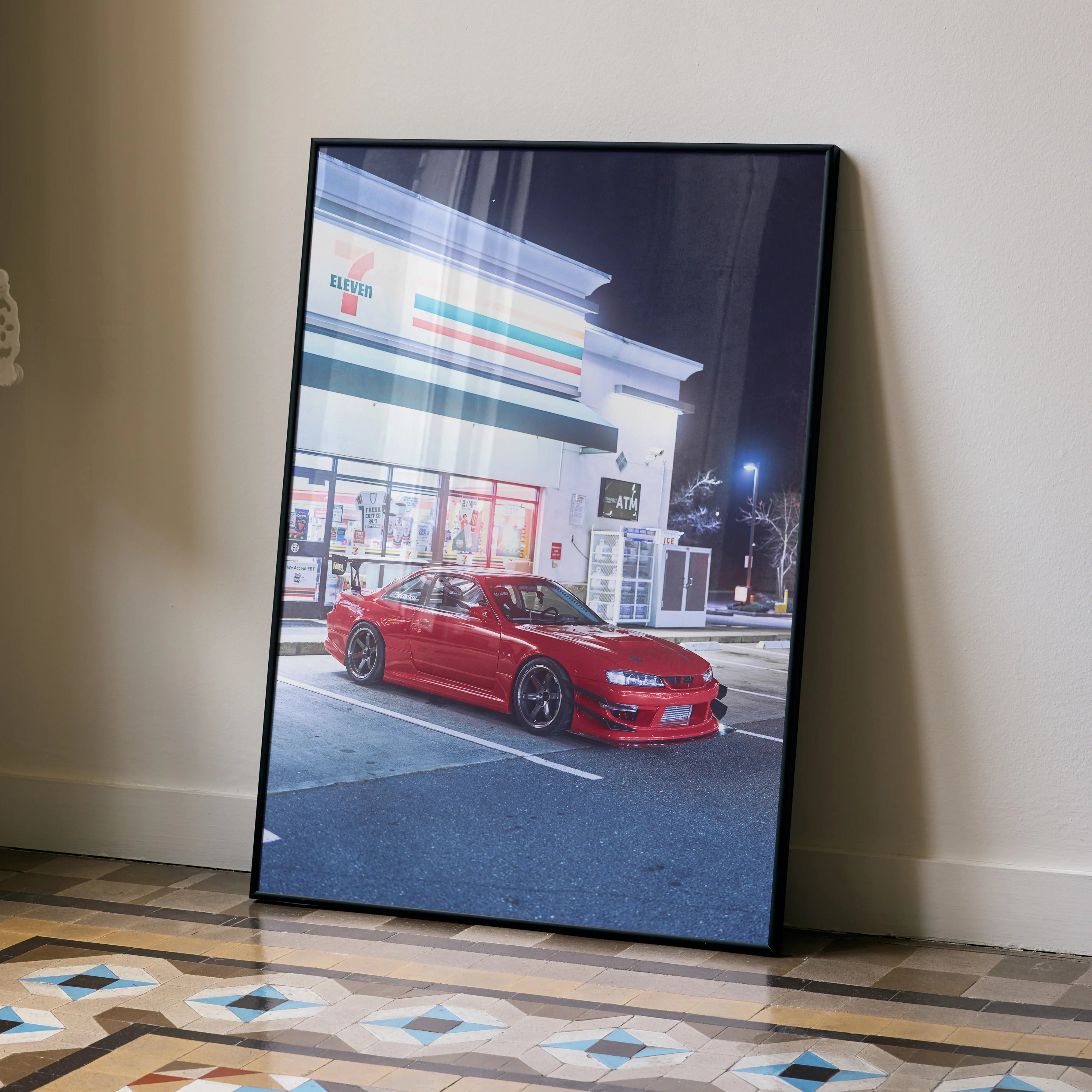Red Nissan 240sx S14 Kouki parked outside a store at night poster wall art in black frame.