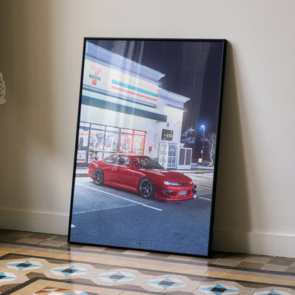 Red Nissan 240sx S14 Kouki parked outside a store at night poster wall art in black frame.