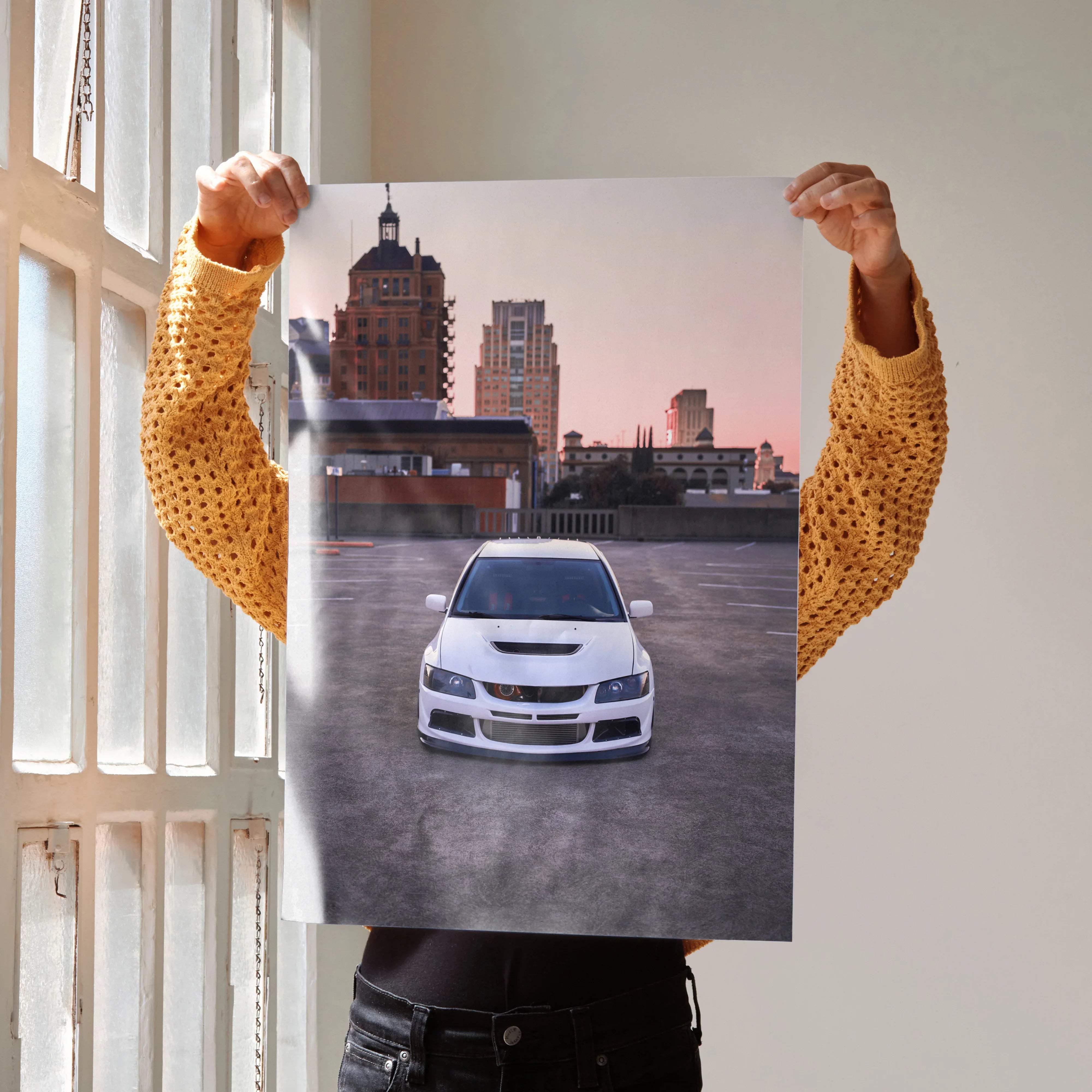 Mitsubishi Evo 8 white car poster wall art with urban skyline background at sunset.
