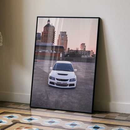 Mitsubishi Evo 8 poster showing front view of white car parked on rooftop at sunset urban wall art.