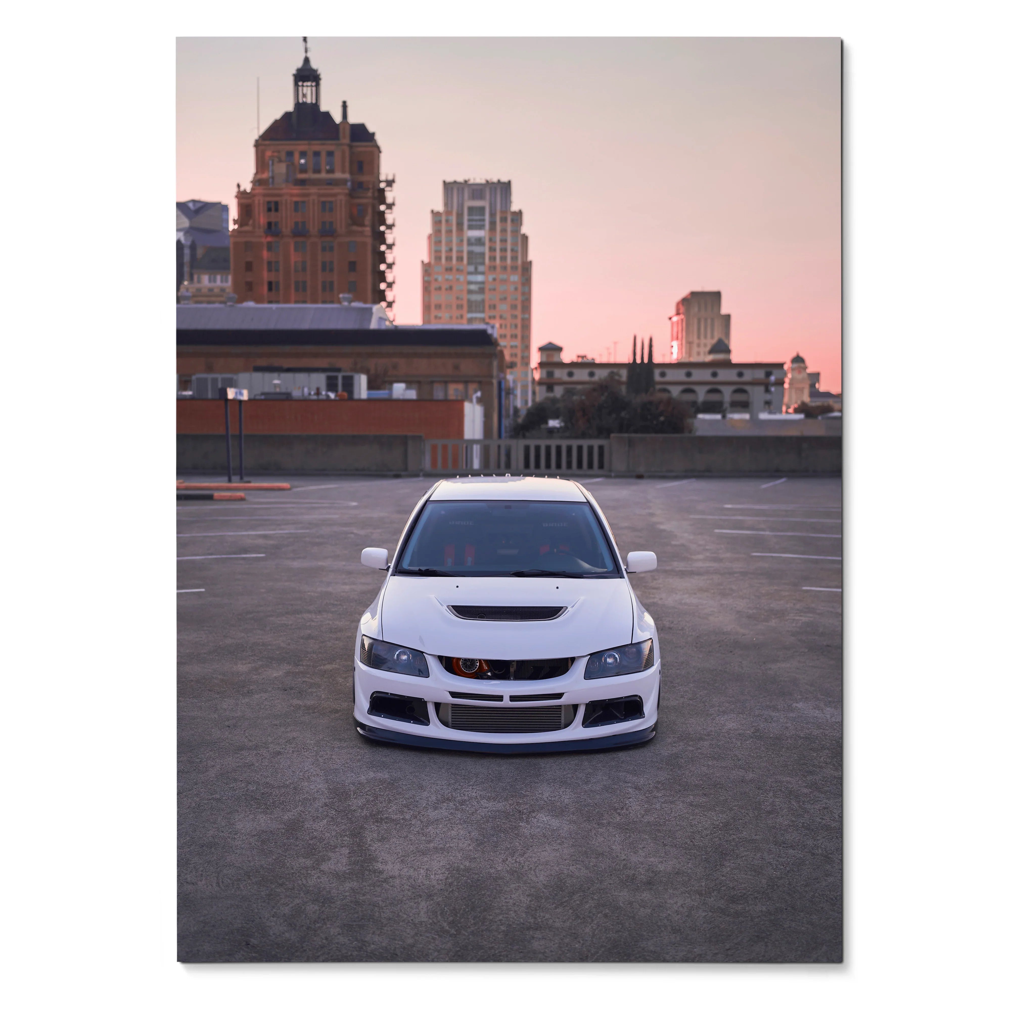 White Mitsubishi Evo 8 parked on rooftop at sunset poster wall art.