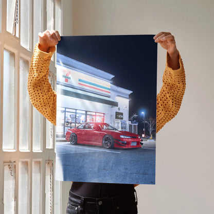 Red Nissan 240sx S14 Kouki parked at night poster wall art with modern building background.