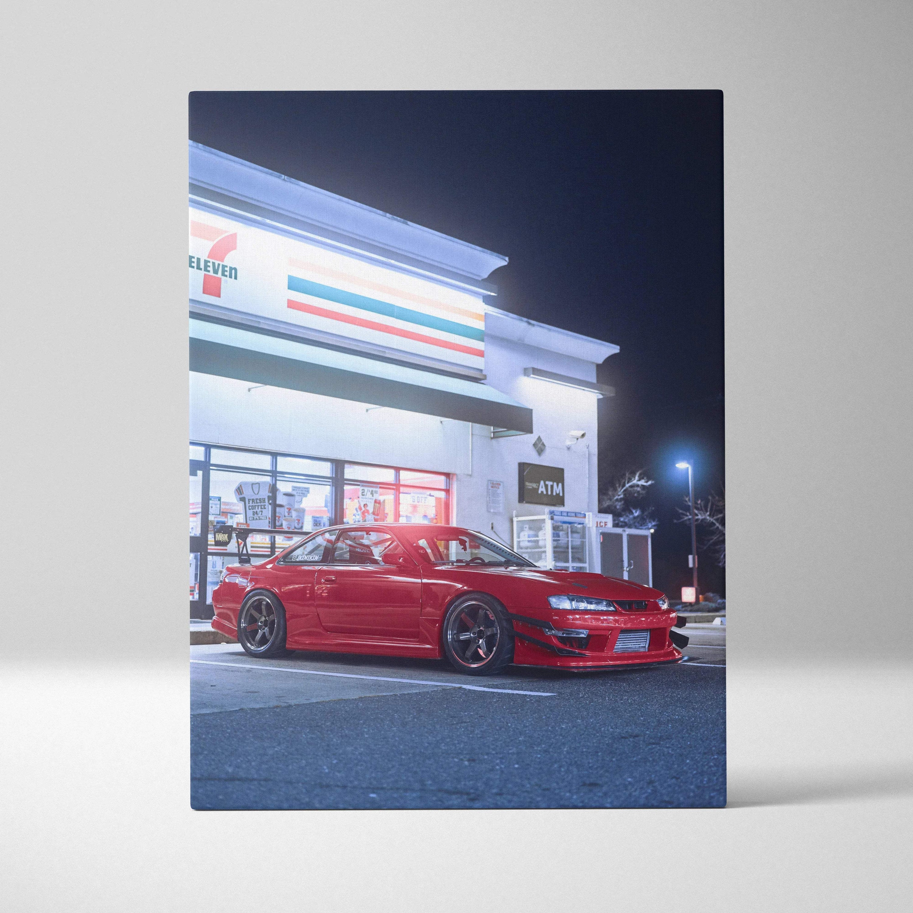 Red Nissan 240sx S14 Kouki parked outside a lit convenience store at night canvas wall art.