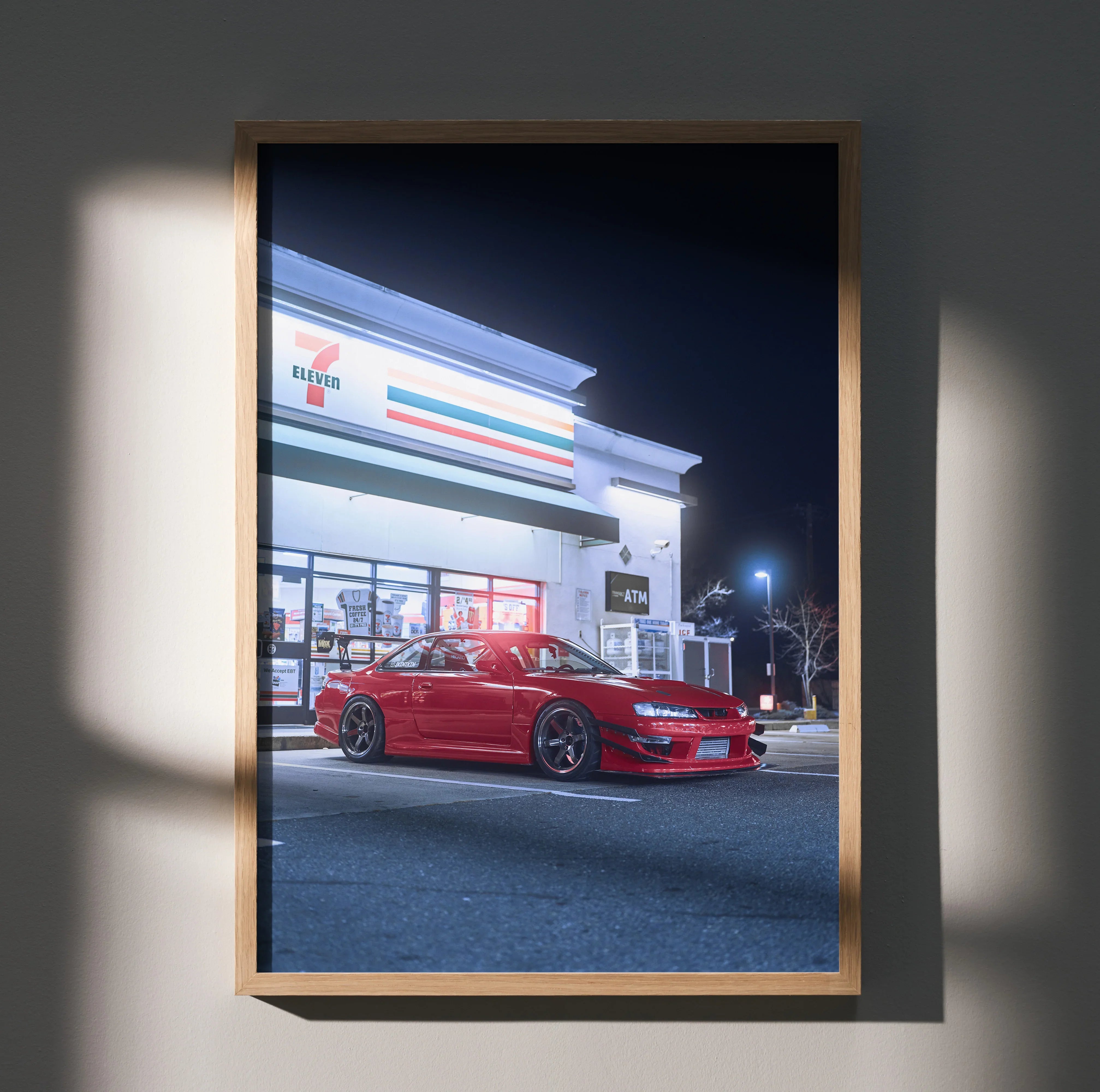 Red Nissan 240sx S14 Kouki parked under 7-Eleven sign at night poster wall art.