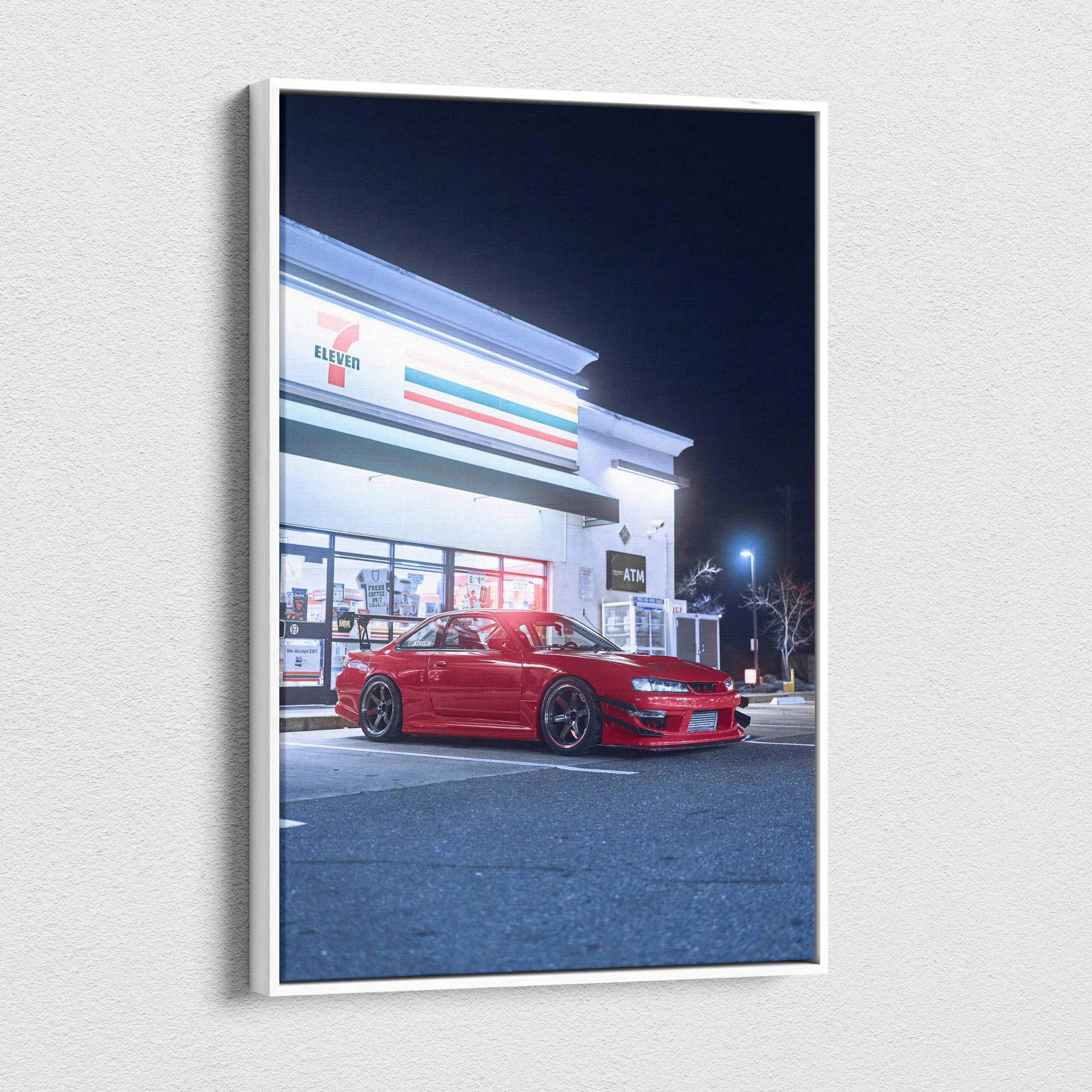 Vertical canvas wall art featuring a red Nissan 240sx S14 Kouki parked outside a lit convenience store at night.