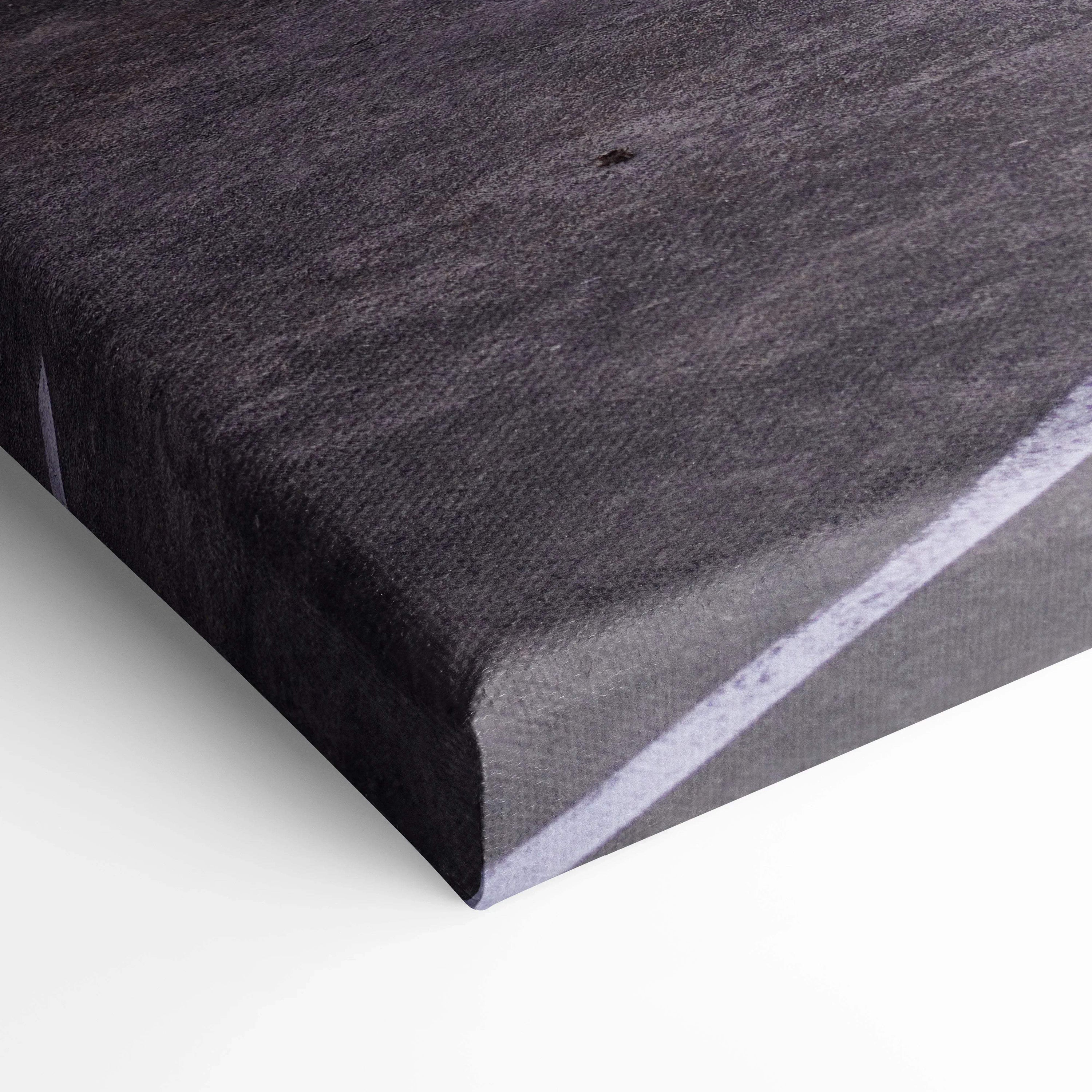 Close-up of dark textured canvas corner showing high-quality wall art material with a museum-quality finish.