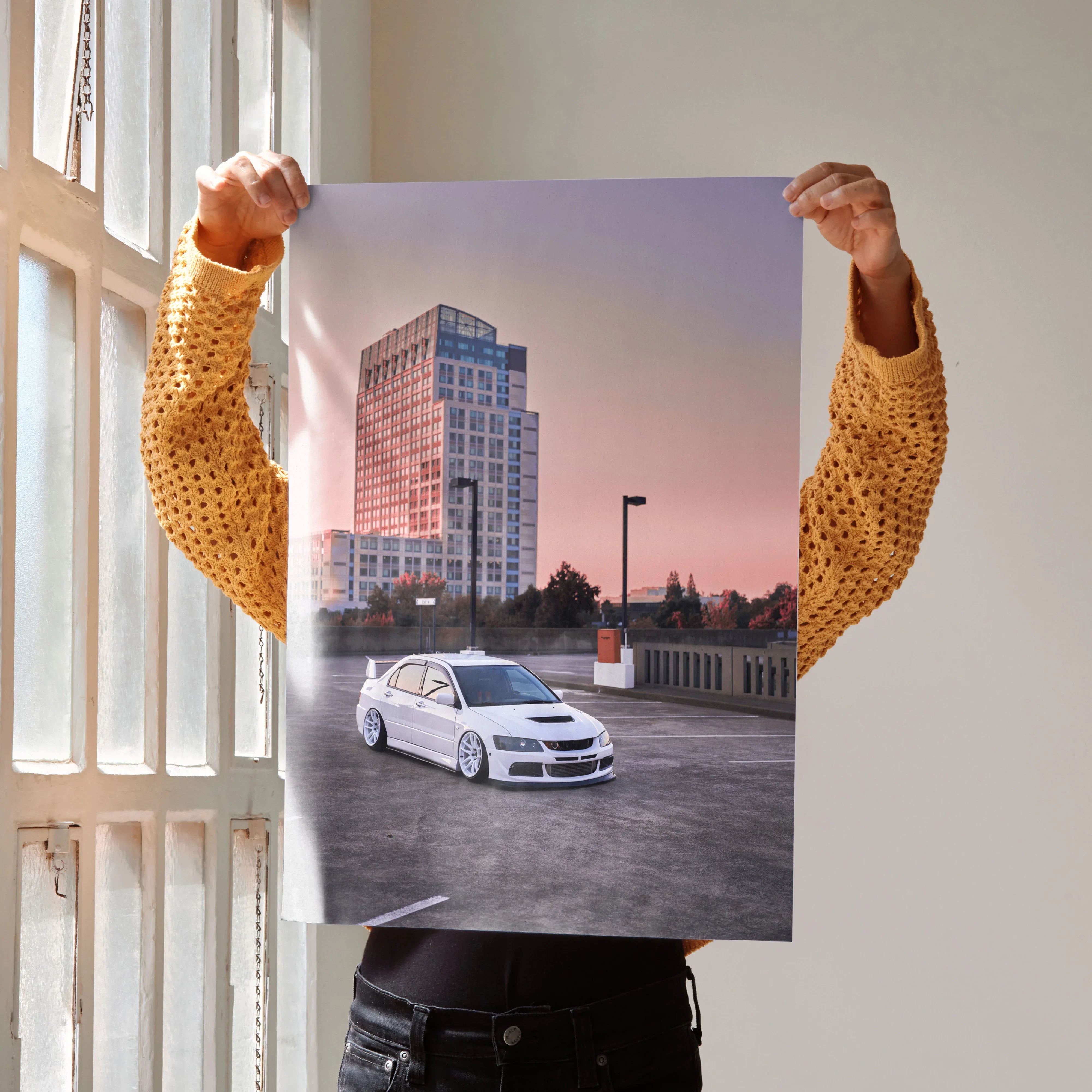 Mitsubishi Evo 8 poster showing white Evo 8 car on rooftop at sunset with city skyline wall art.