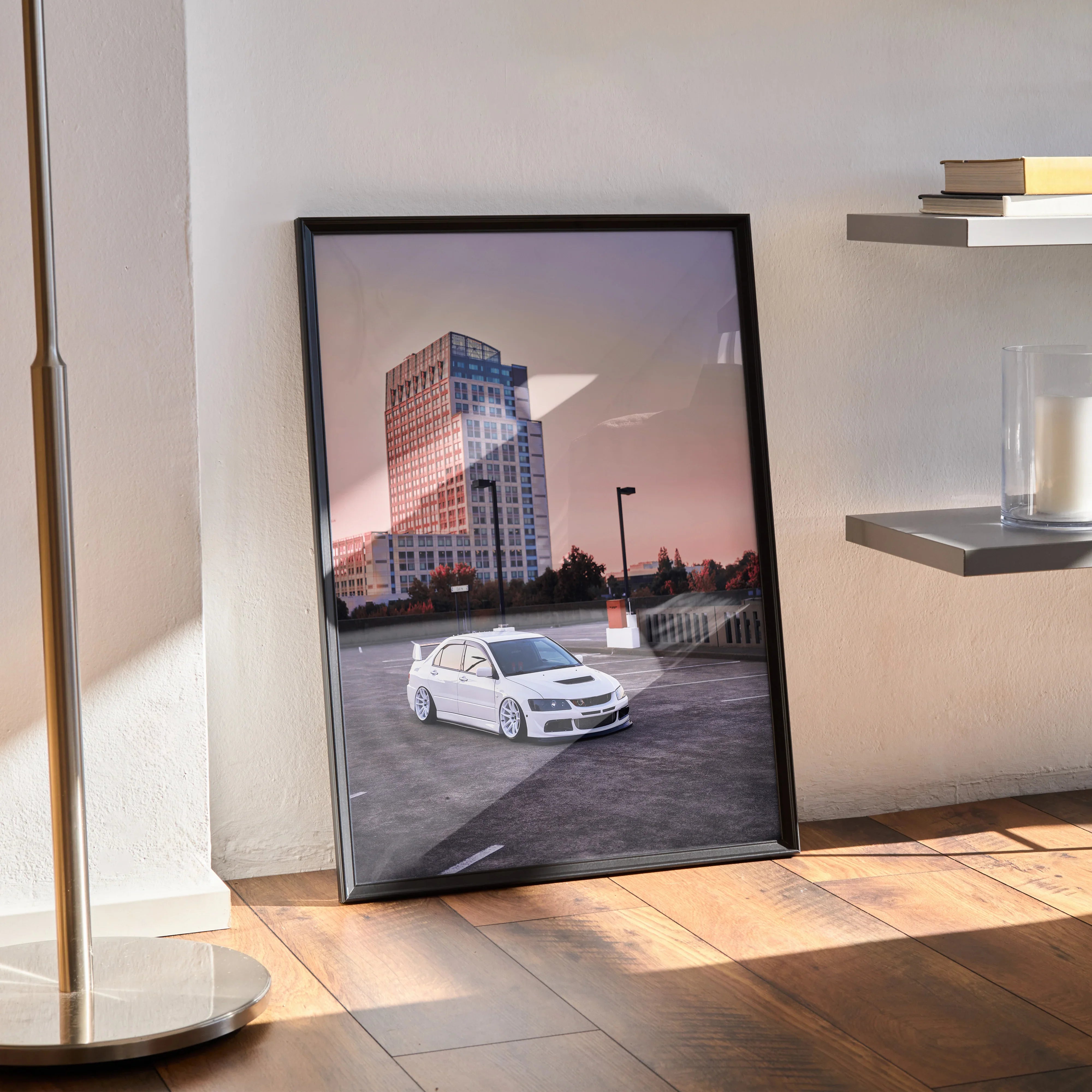 Mitsubishi Evo 8 poster with urban sunset background, framed wall art standing on hardwood floor.