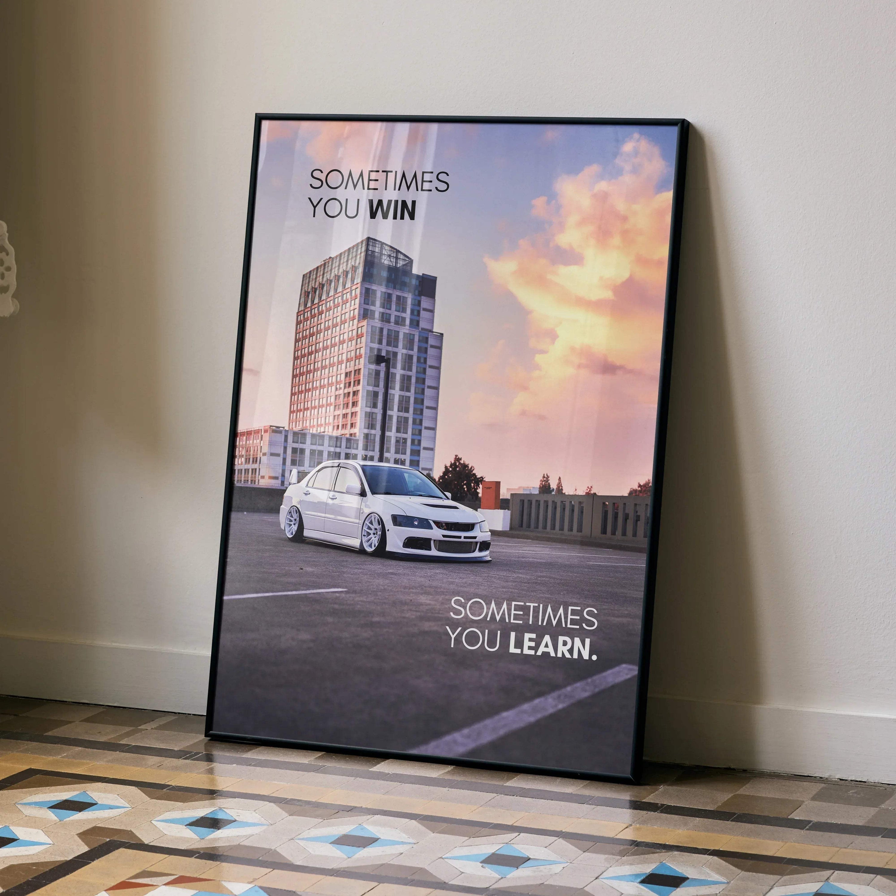 Motivational wall art poster featuring a white Mitsubishi Evo 8 car with inspiring text against a sunset sky background.