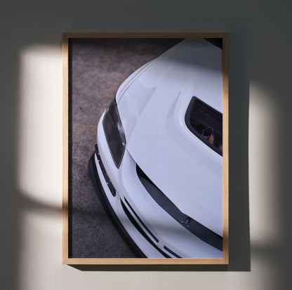 White Mitsubishi Evo 8 front close-up poster with sleek hood and headlight wall art in wooden frame.