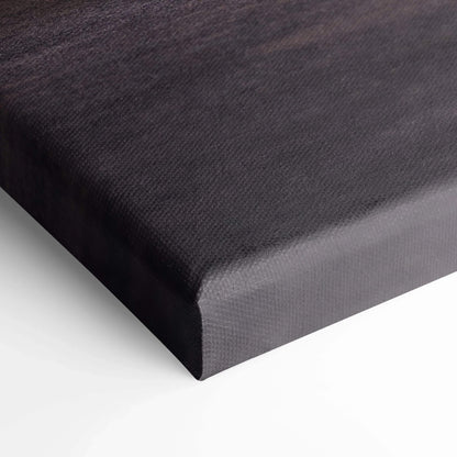 Close-up of black textured canvas art stretched over thick edges for wall art display.