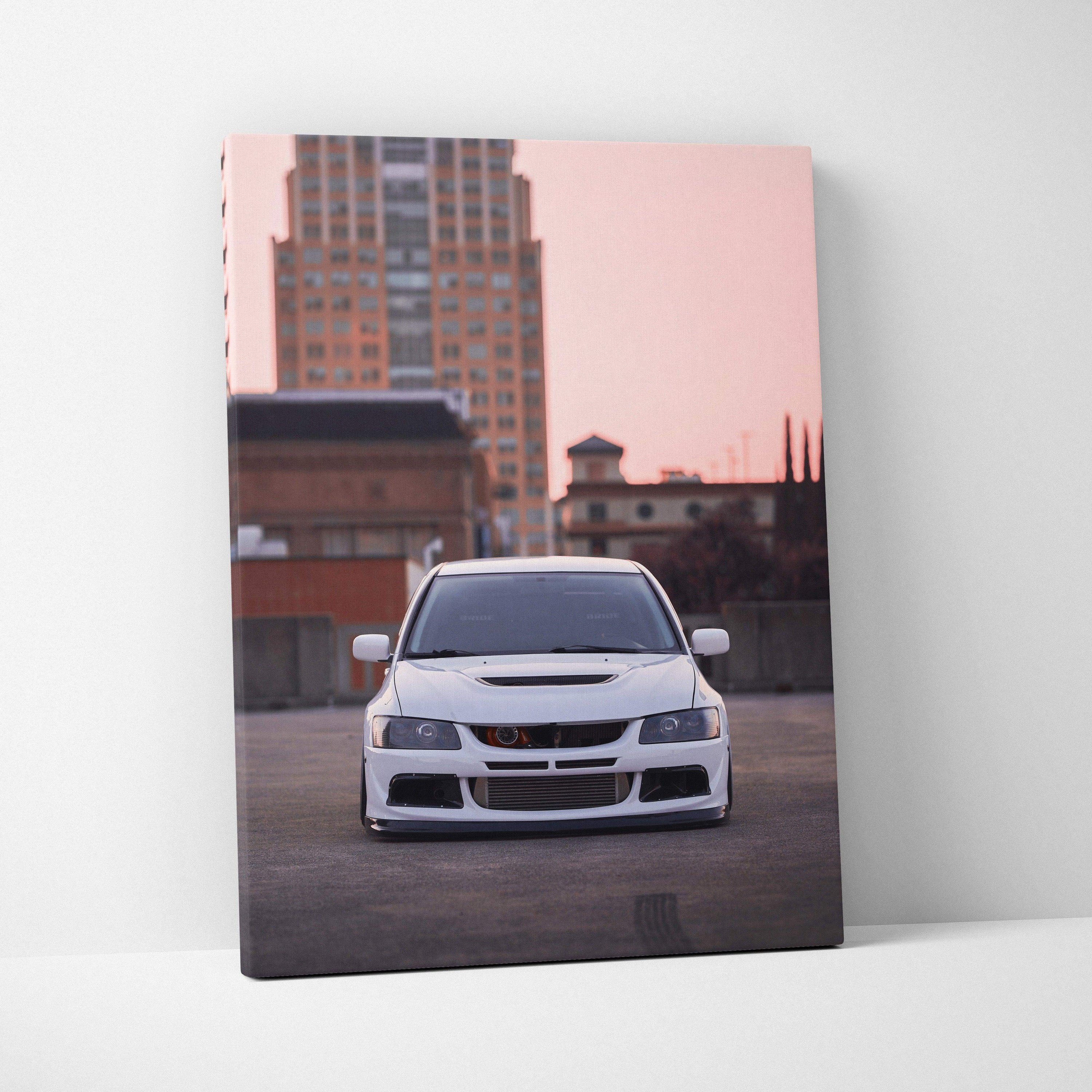 Mitsubishi Evo 8 front view car canvas wall art in urban setting with pink sky background.