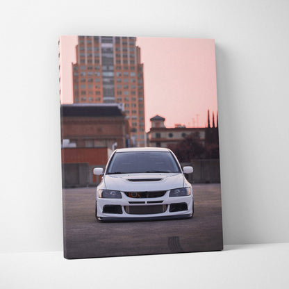 Mitsubishi Evo 8 front view car canvas wall art in urban setting with pink sky background.
