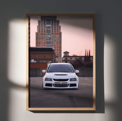 Mitsubishi Evo 8 front view poster wall art with urban skyline background in a wooden frame.