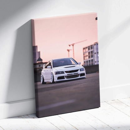 Vertical canvas art featuring a white Mitsubishi Evo 8 car against an urban sunset background wall art.