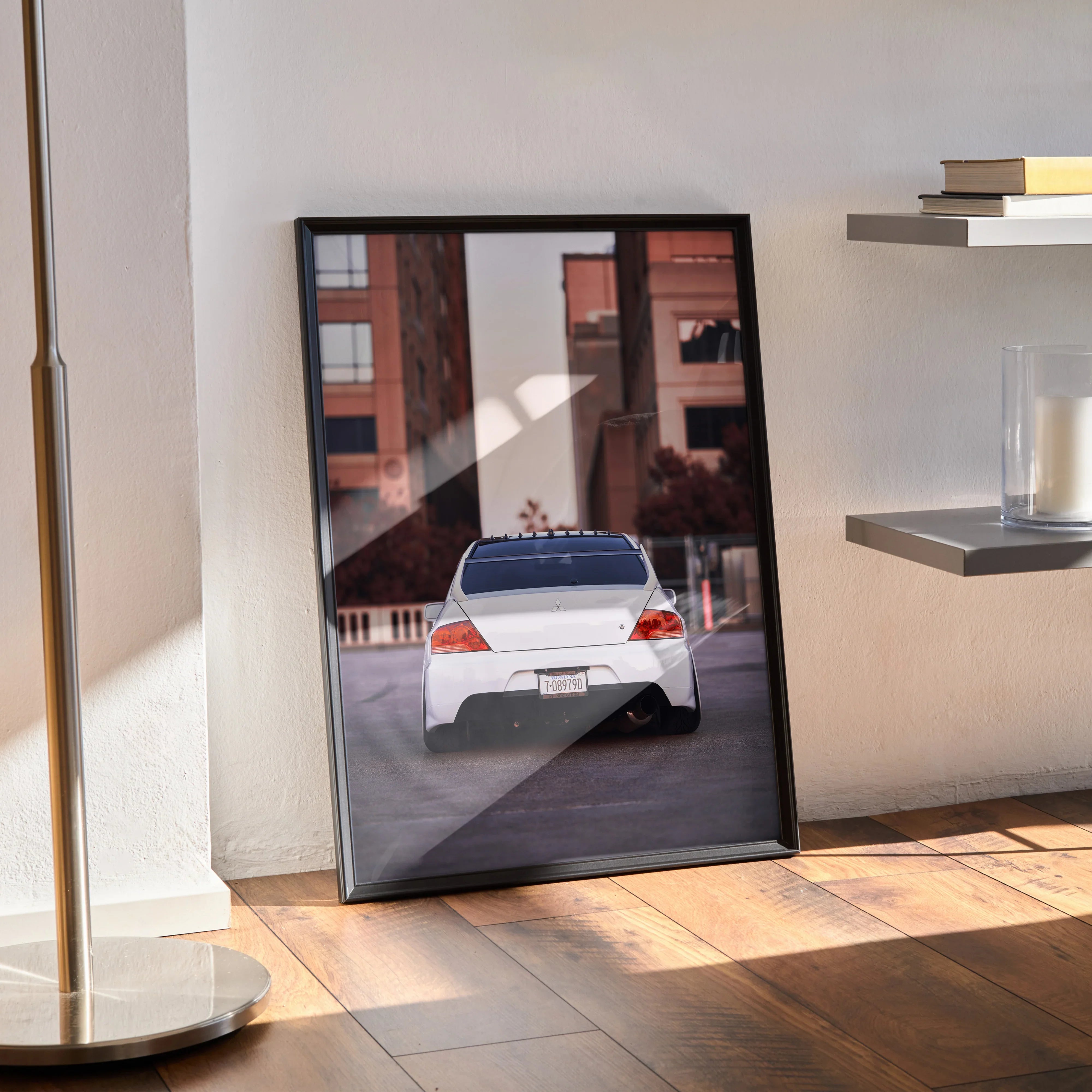 Mitsubishi Evo 8 rear view poster framed wall art with urban background in sunlight.