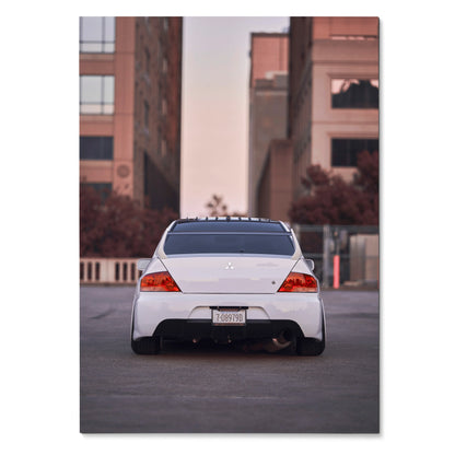 White Mitsubishi Evo 8 poster showing rear view with urban background wall art.