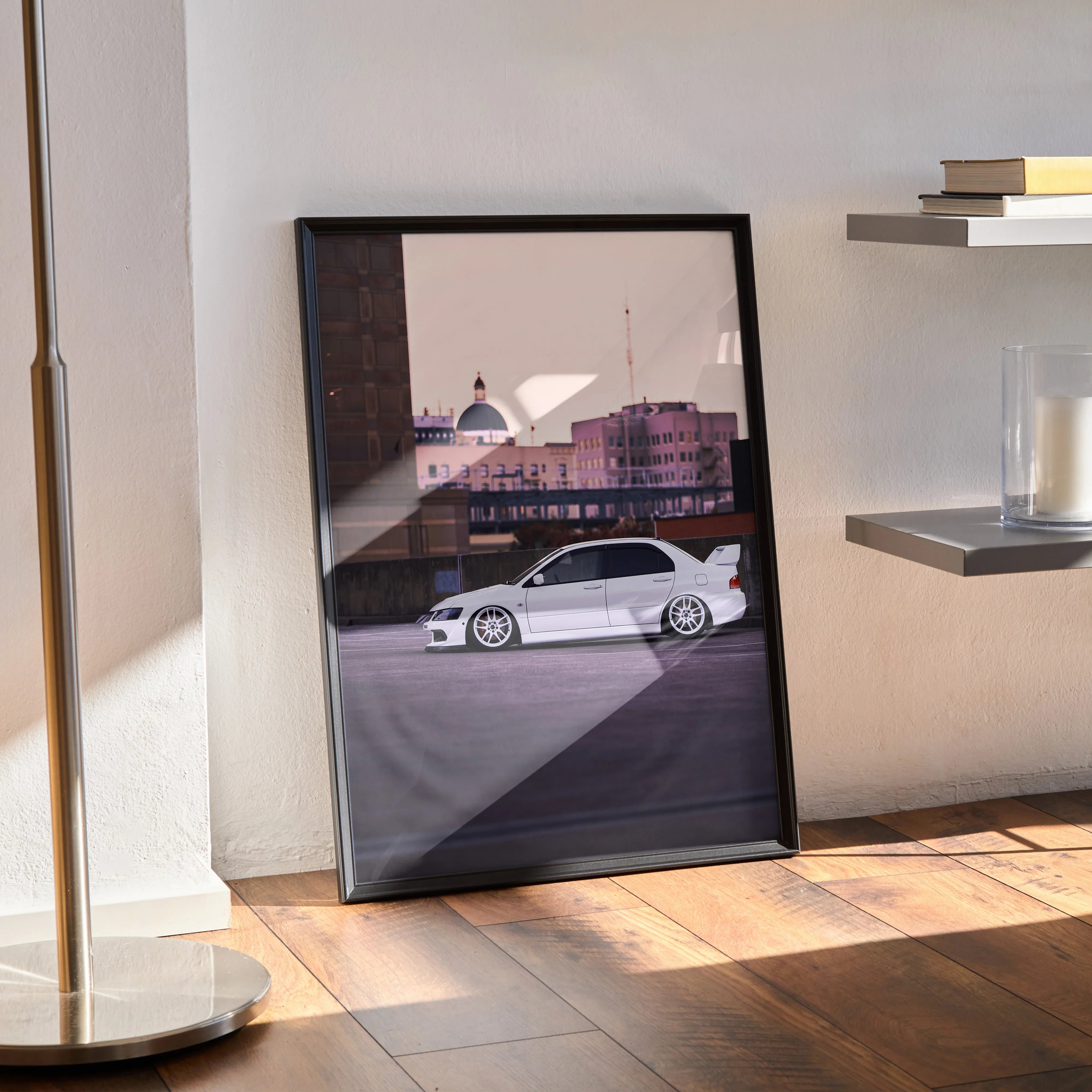 Mitsubishi Evo 8 white car poster in sleek black frame leaning against wall, modern wall art.