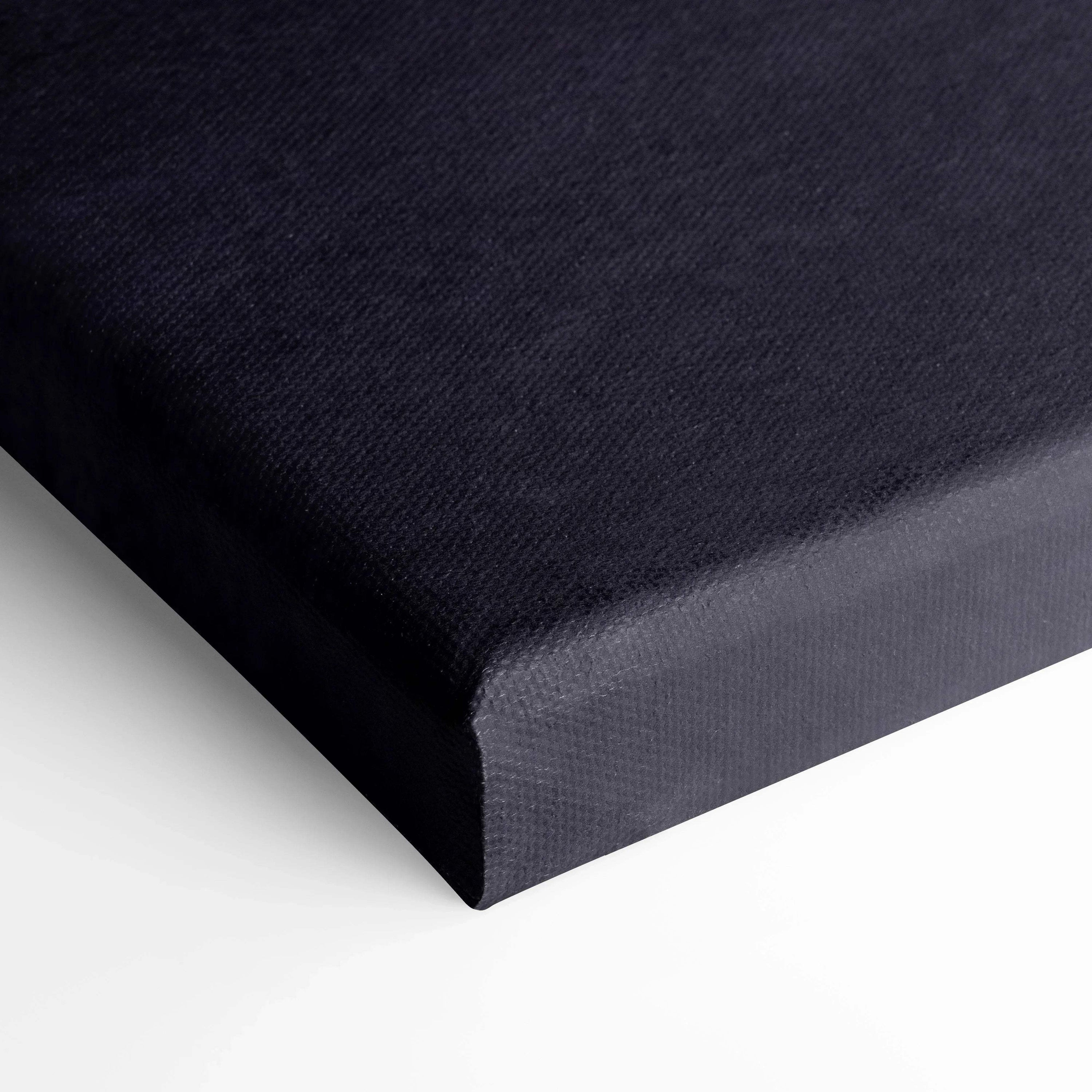 Black stretched canvas corner with textured fabric surface for wall art or canvas art print.