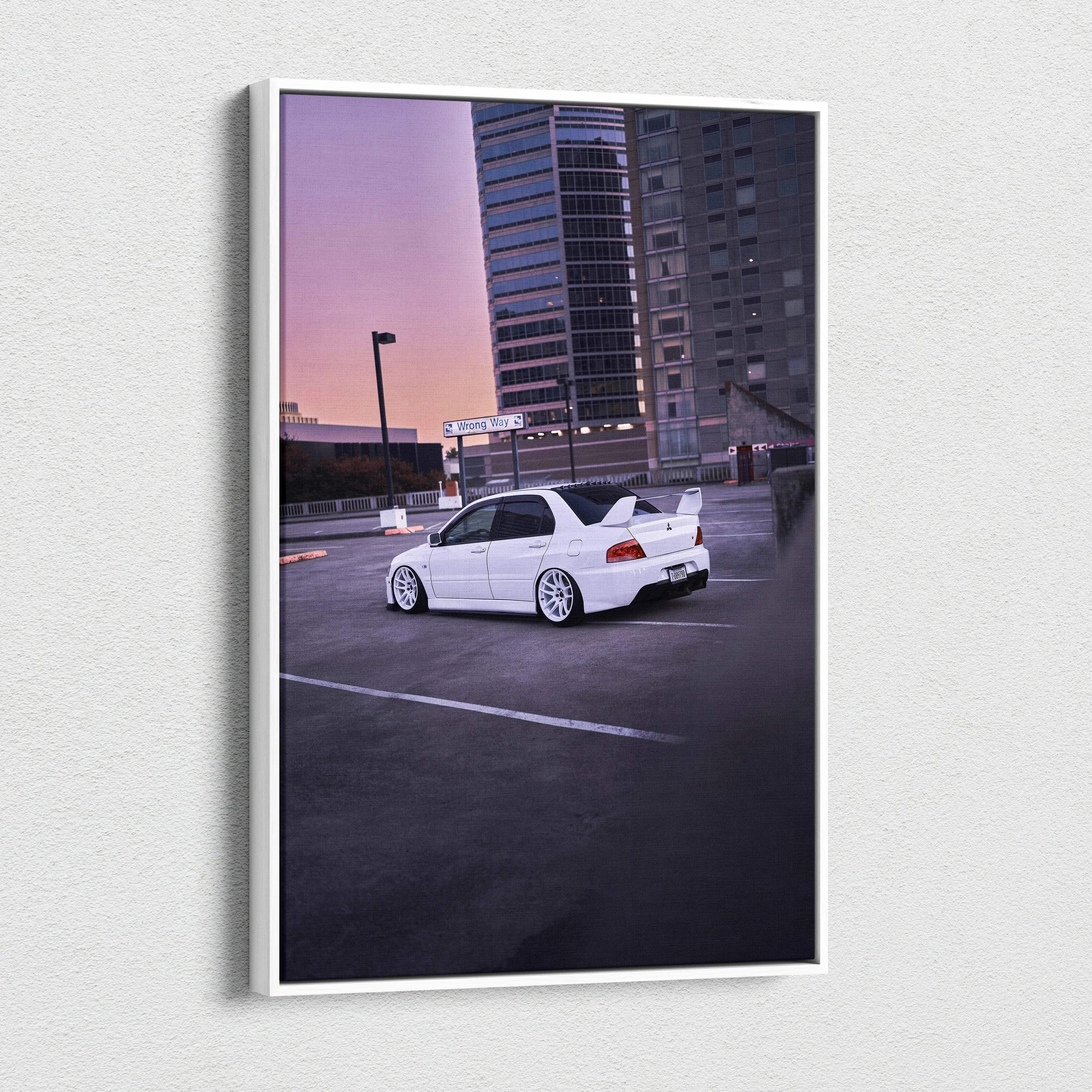 Vertical canvas art featuring a white Mitsubishi Evo 8 parked in an urban rooftop setting at sunset, wall art for car.