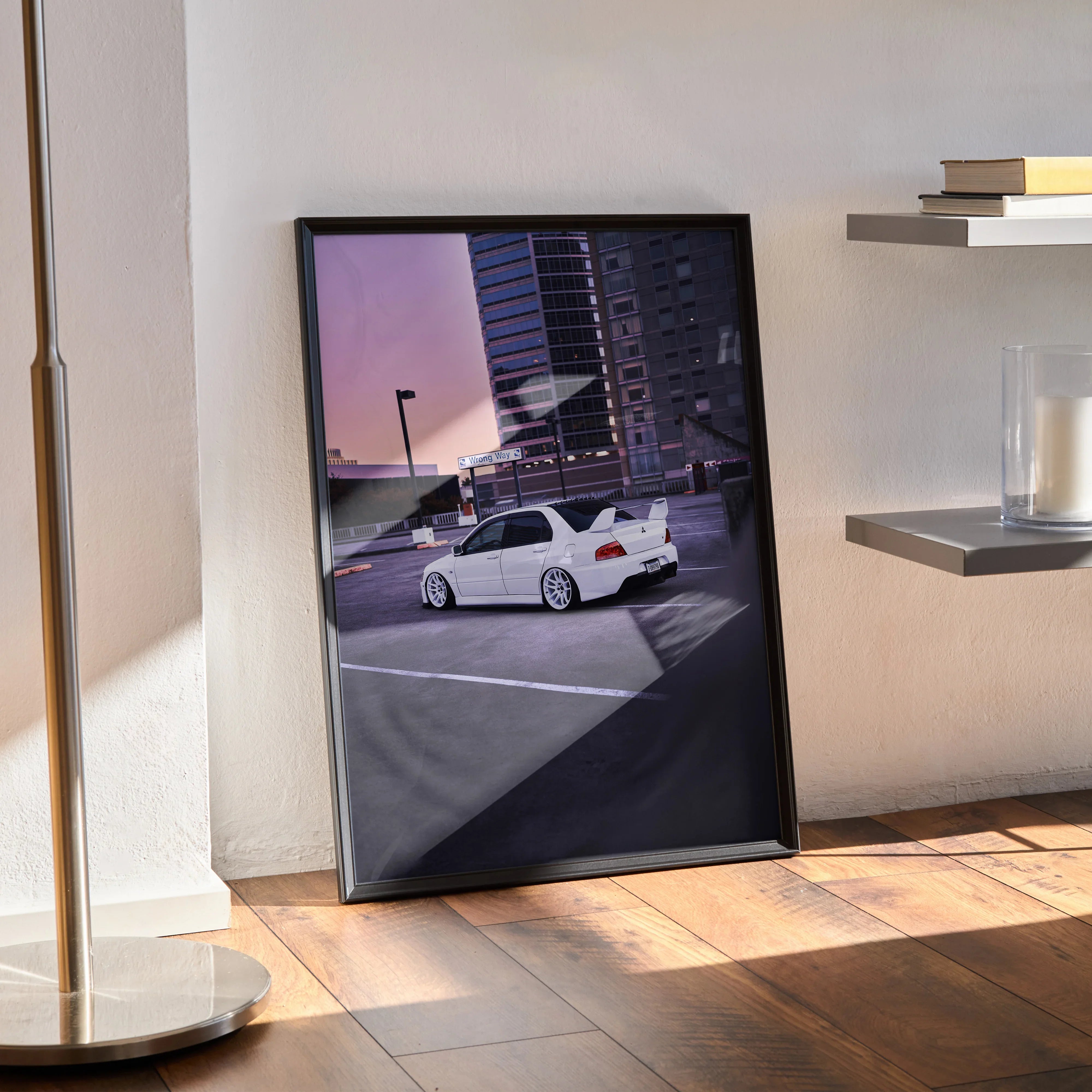 Mitsubishi Evo 8 white car poster leaning on floor in black frame, urban background wall art.