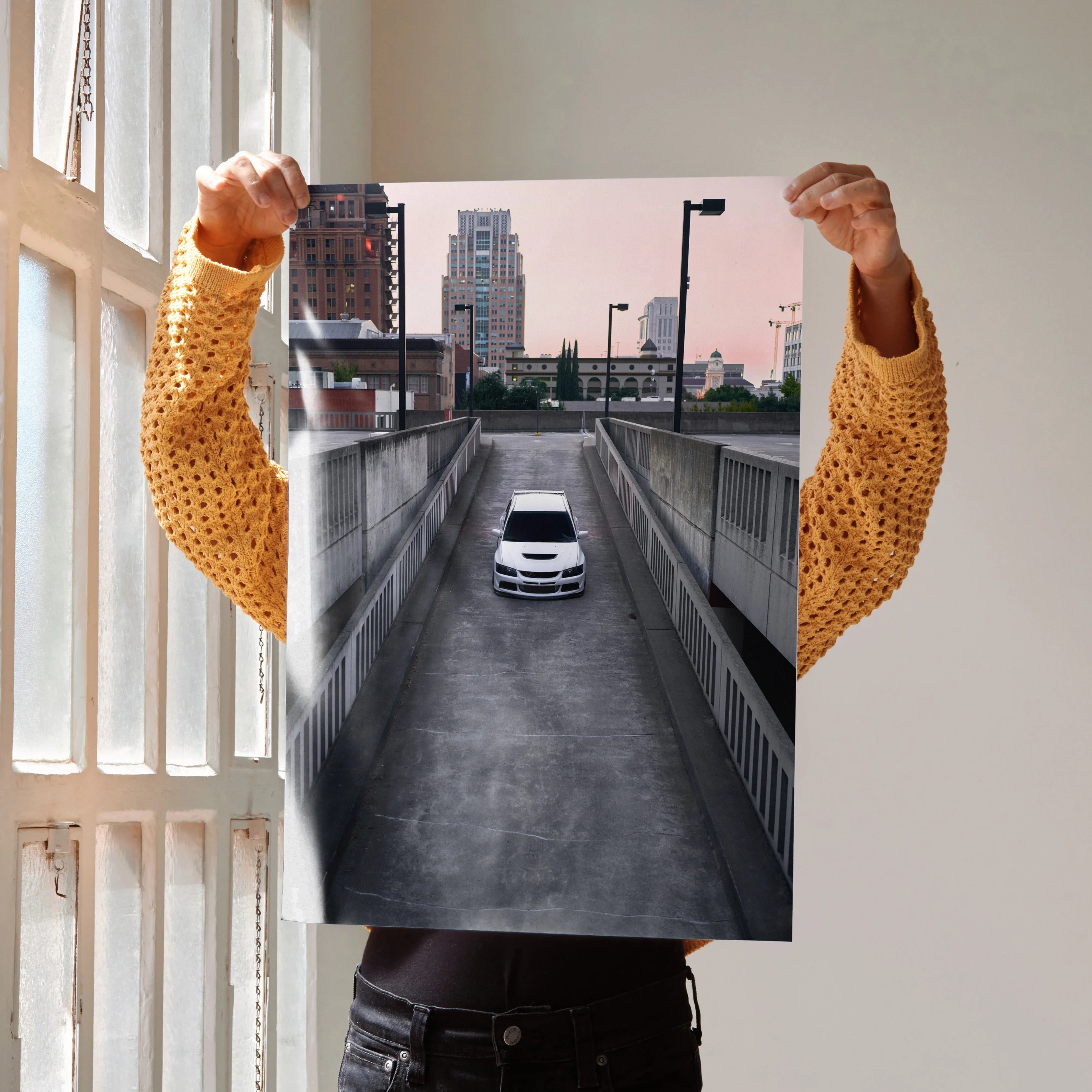 Mitsubishi Evo 8 driving down urban driveway poster wall art with cityscape background.