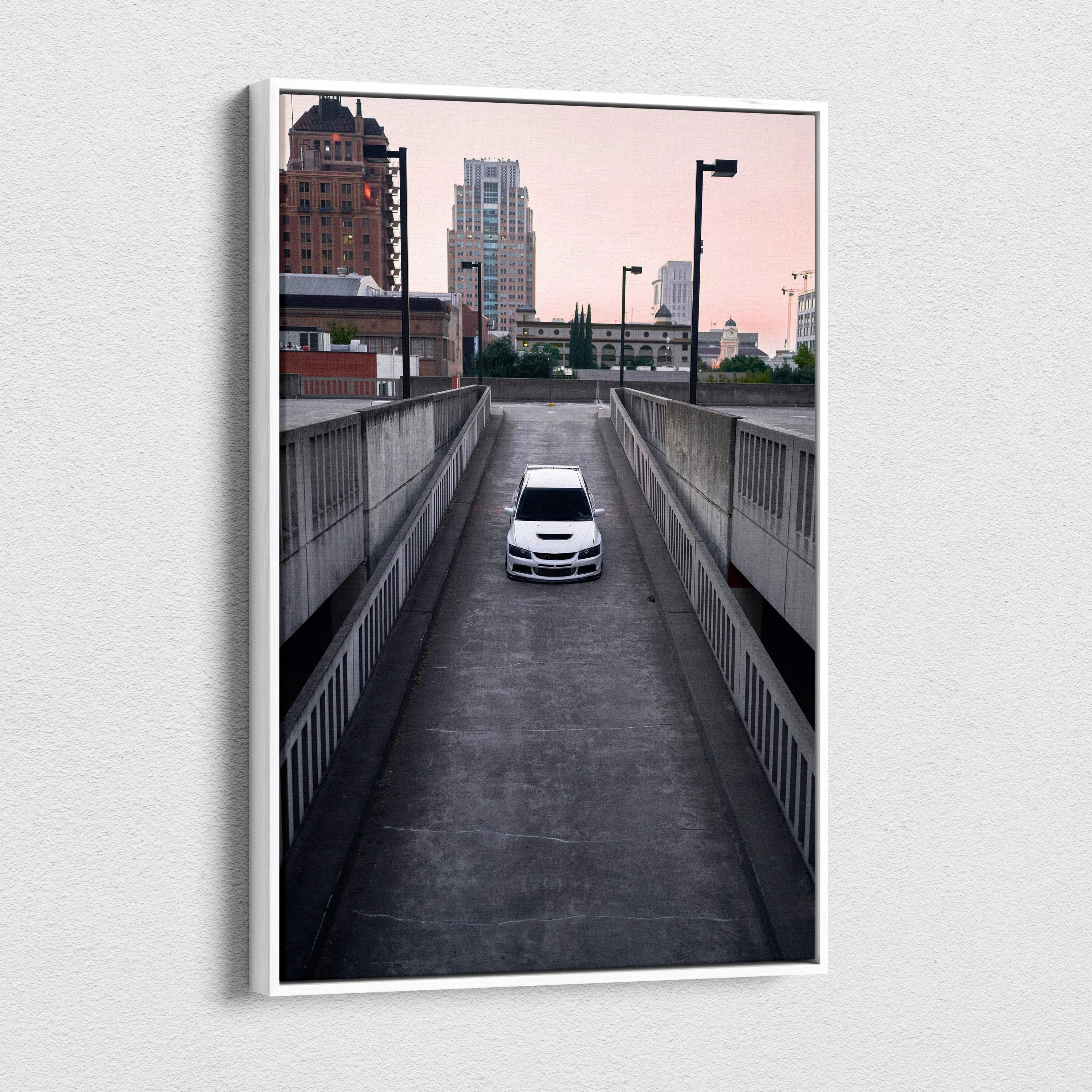 Mitsubishi Evo 8 white car driving downhill urban setting canvas wall art print.