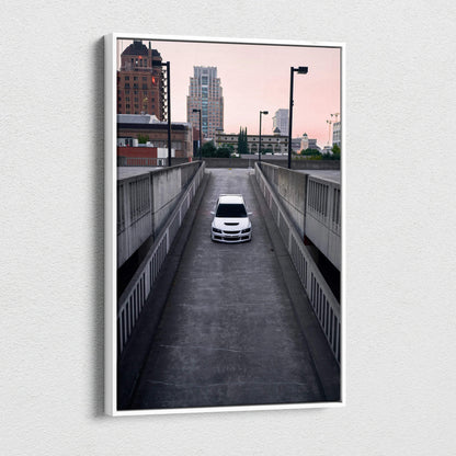 Mitsubishi Evo 8 white car driving downhill urban setting canvas wall art print.