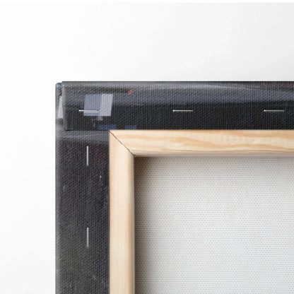 Close-up of wooden frame and stapled stretched canvas art for wall décor.