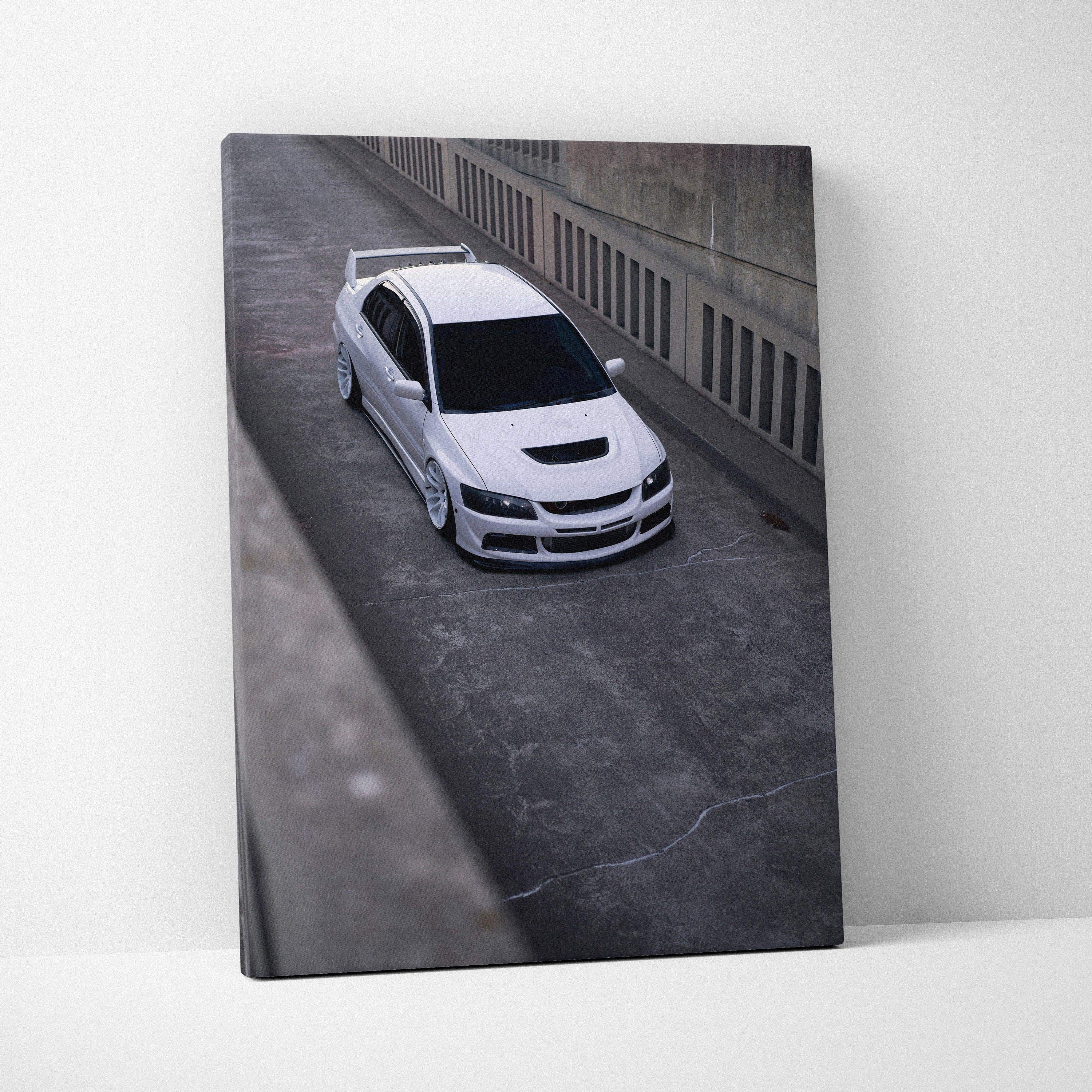 Vertical canvas art featuring a white Mitsubishi Evo 8 on a concrete road, modern wall art print.