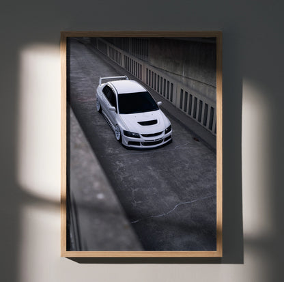 Mitsubishi Evo 8 white car poster wall art in urban concrete setting with shadow play.