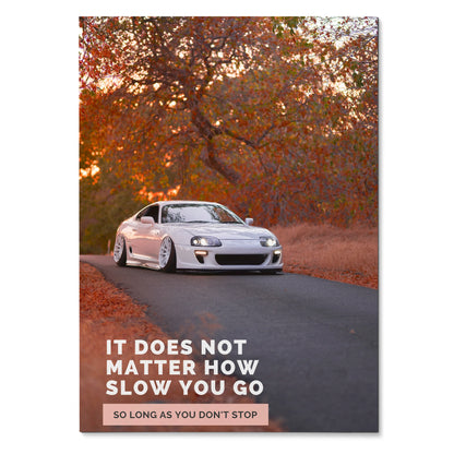 White Toyota Supra Mk4 on winding road with autumn trees and motivational text poster wall art.