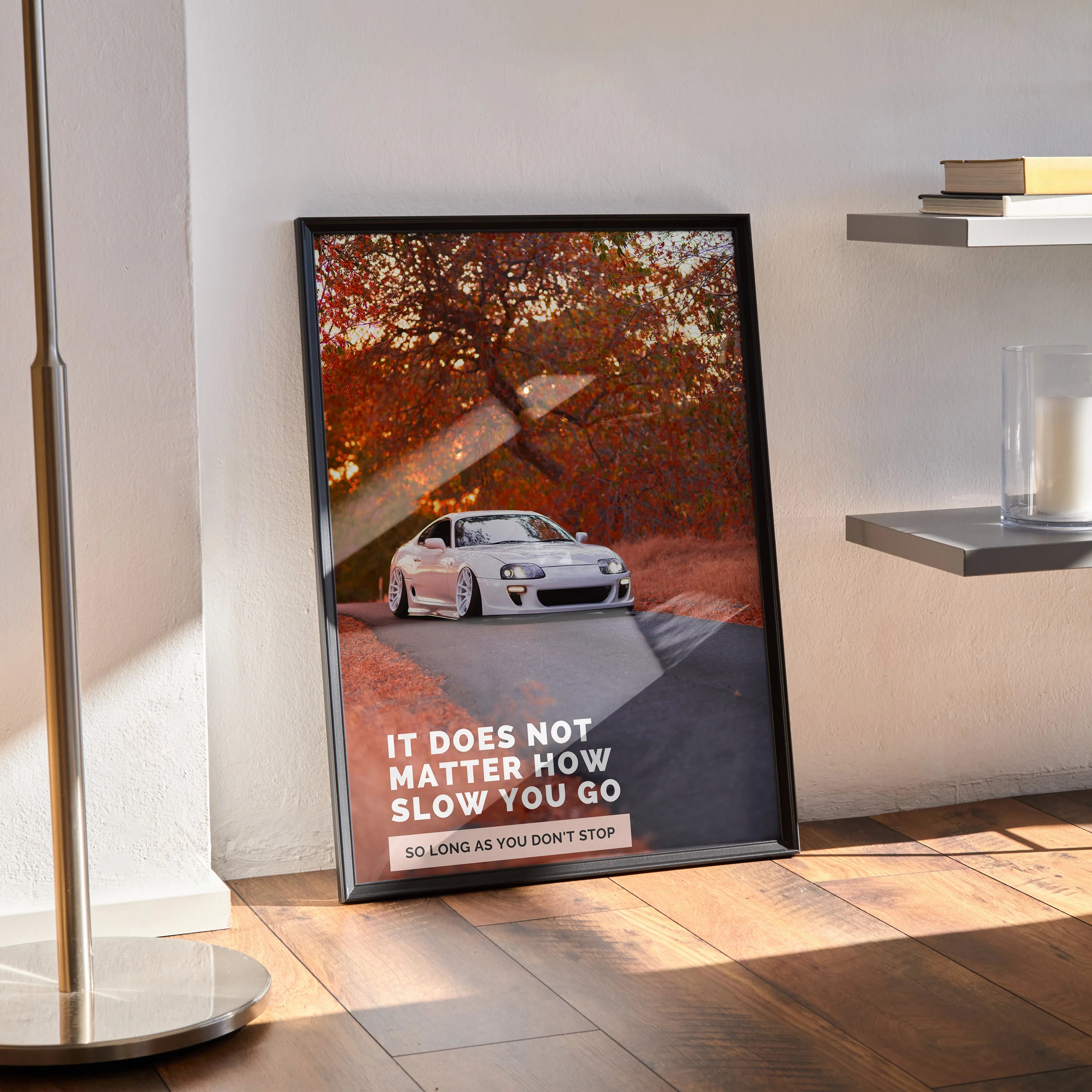 Toyota Supra Mk4 poster with inspirational text and autumn trees wall art in black frame.
