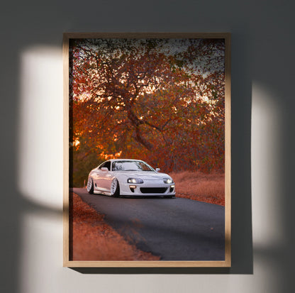 Toyota Supra MK4 poster with white car on autumn road, vibrant fall colors wall art.