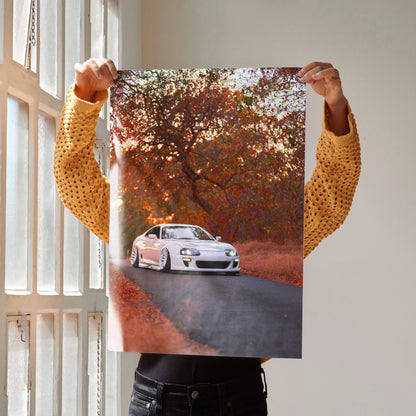 Toyota Supra MK4 on winding road with autumn trees poster wall art.