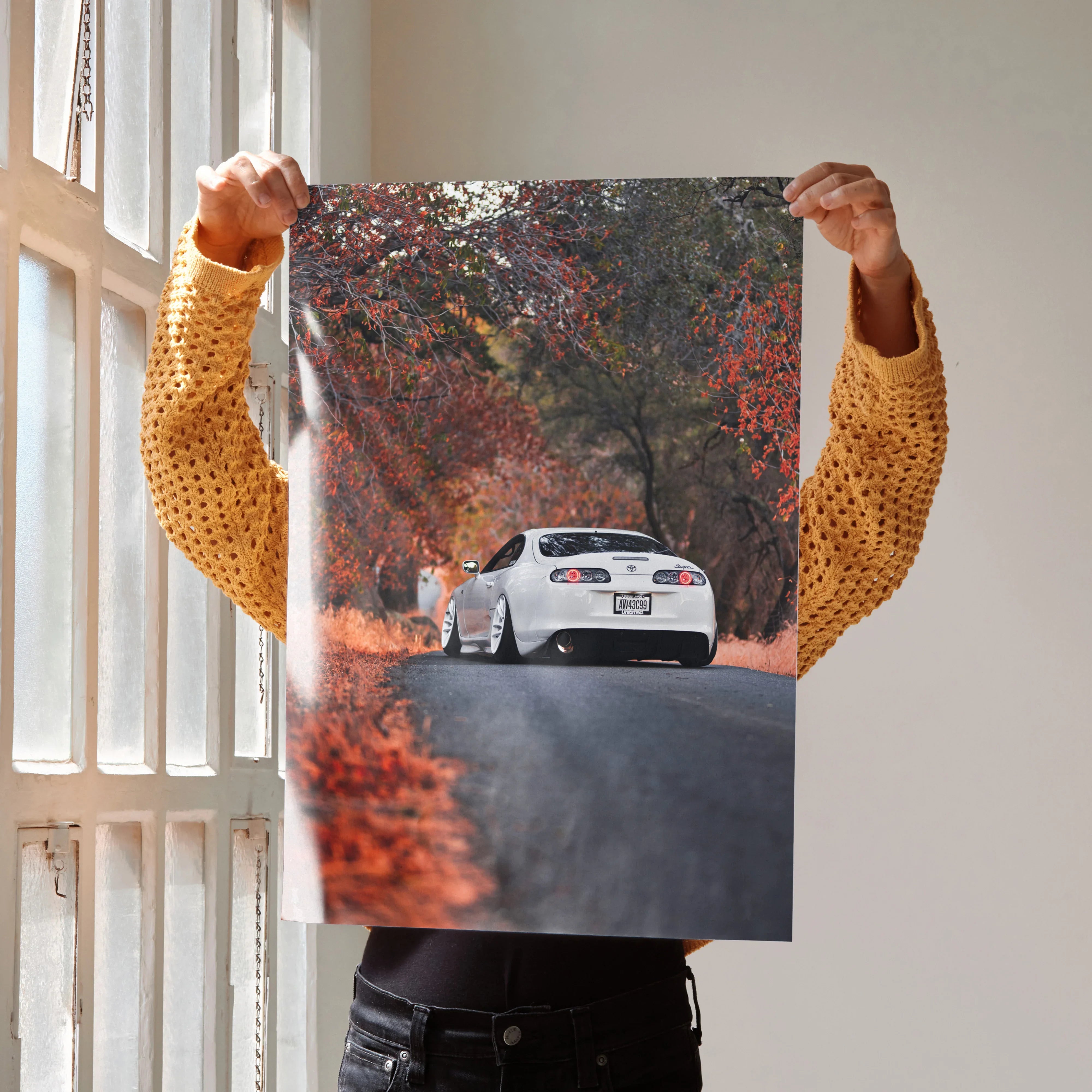 Toyota Supra MK4 on autumn road poster wall art with vibrant fall foliage.