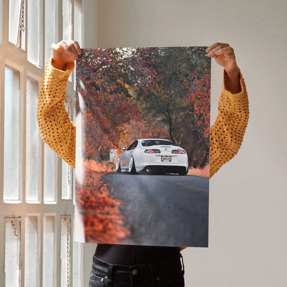 Toyota Supra MK4 on autumn road poster wall art with vibrant fall foliage.