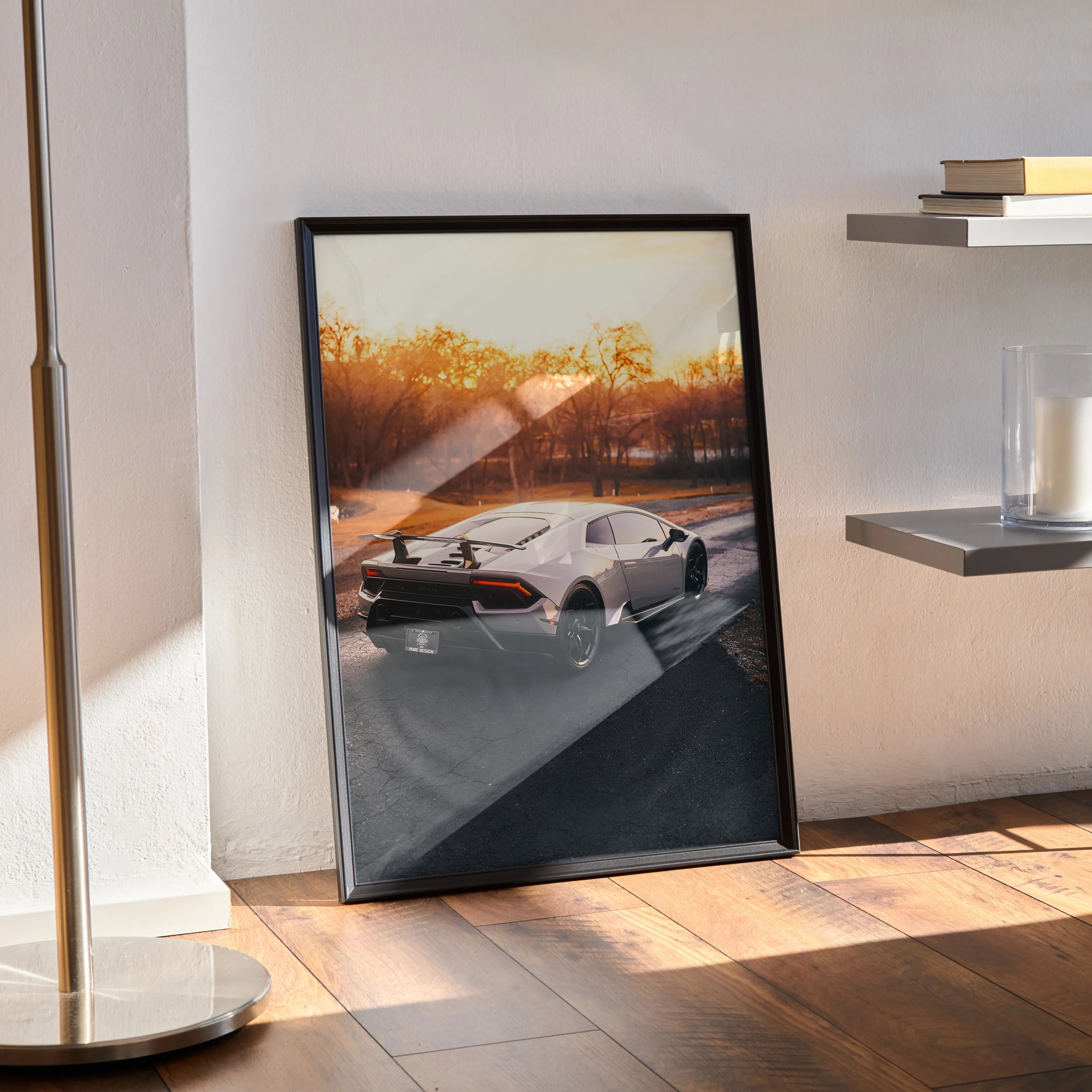 Lamborghini Huracan poster with sunset background leaning against wall, luxury automotive wall art.
